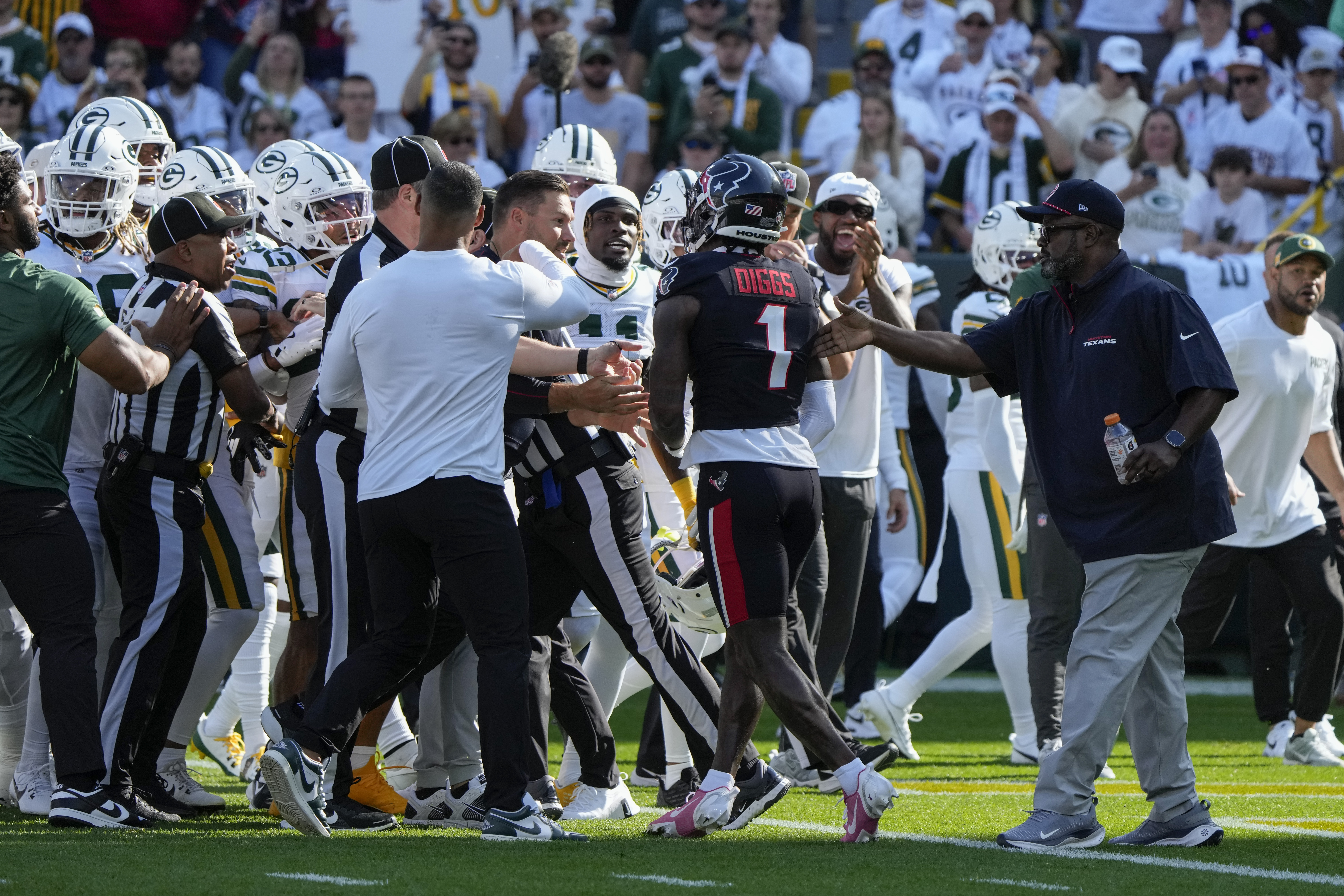 Houston Texans wide receiver Stefon Diggs (1) gets into a scuffle before an NFL football game against the Green Bay Packers, Sunday, Oct. 20, 2024, in Green Bay, Wis. 