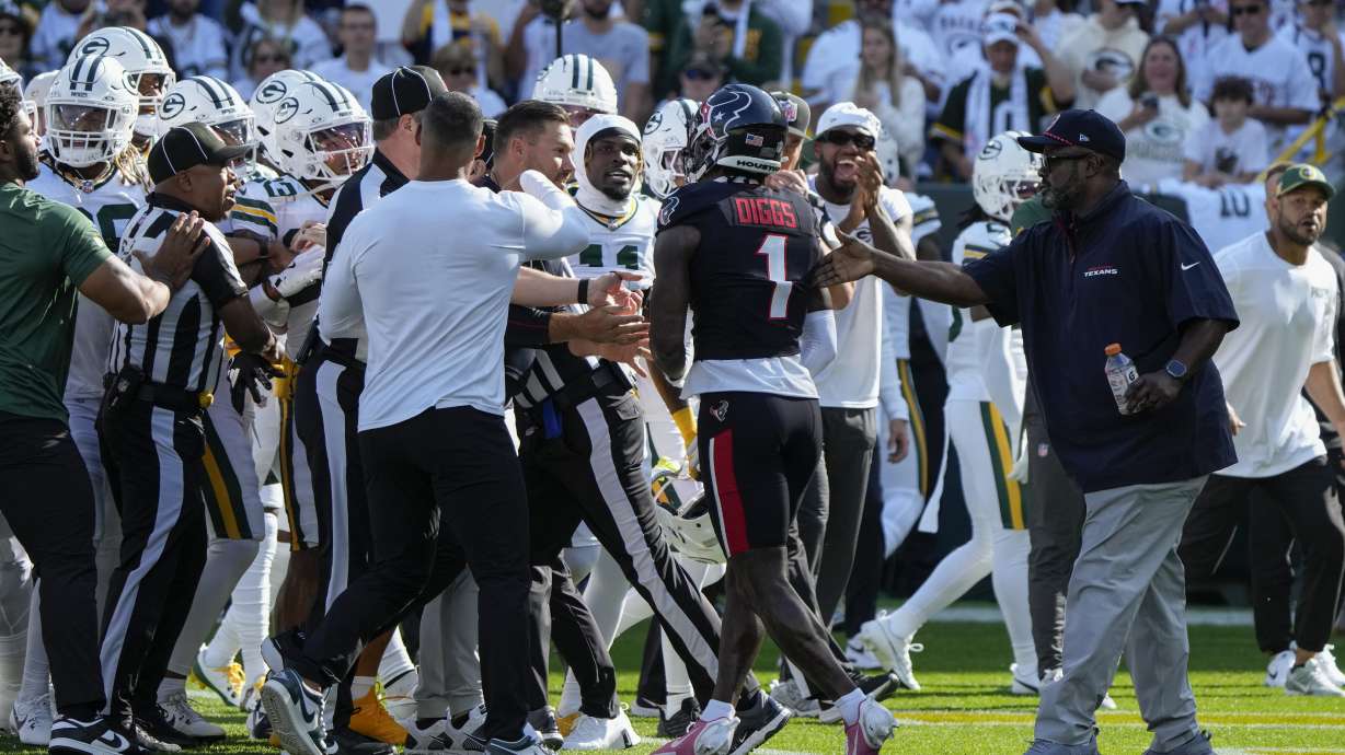 Houston Texans wide receiver Stefon Diggs (1) gets into a scuffle before an NFL football game against the Green Bay Packers, Sunday, Oct. 20, 2024, in Green Bay, Wis.