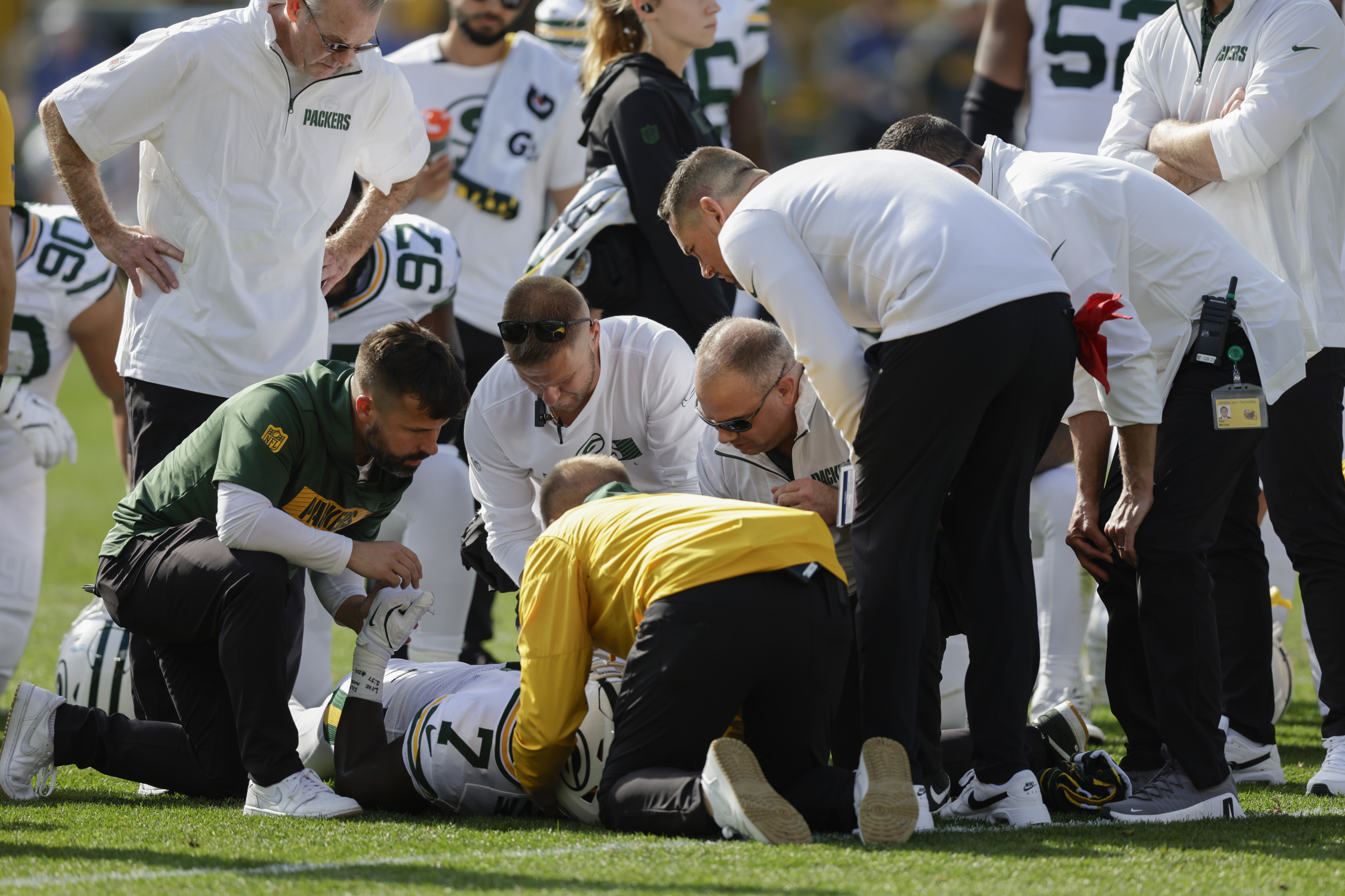 Green Bay Packers linebacker Quay Walker (7) is evaluated after a play during the first half of an NFL football game against the Houston Texans, Sunday, Oct. 20, 2024, in Green Bay, Wis. 