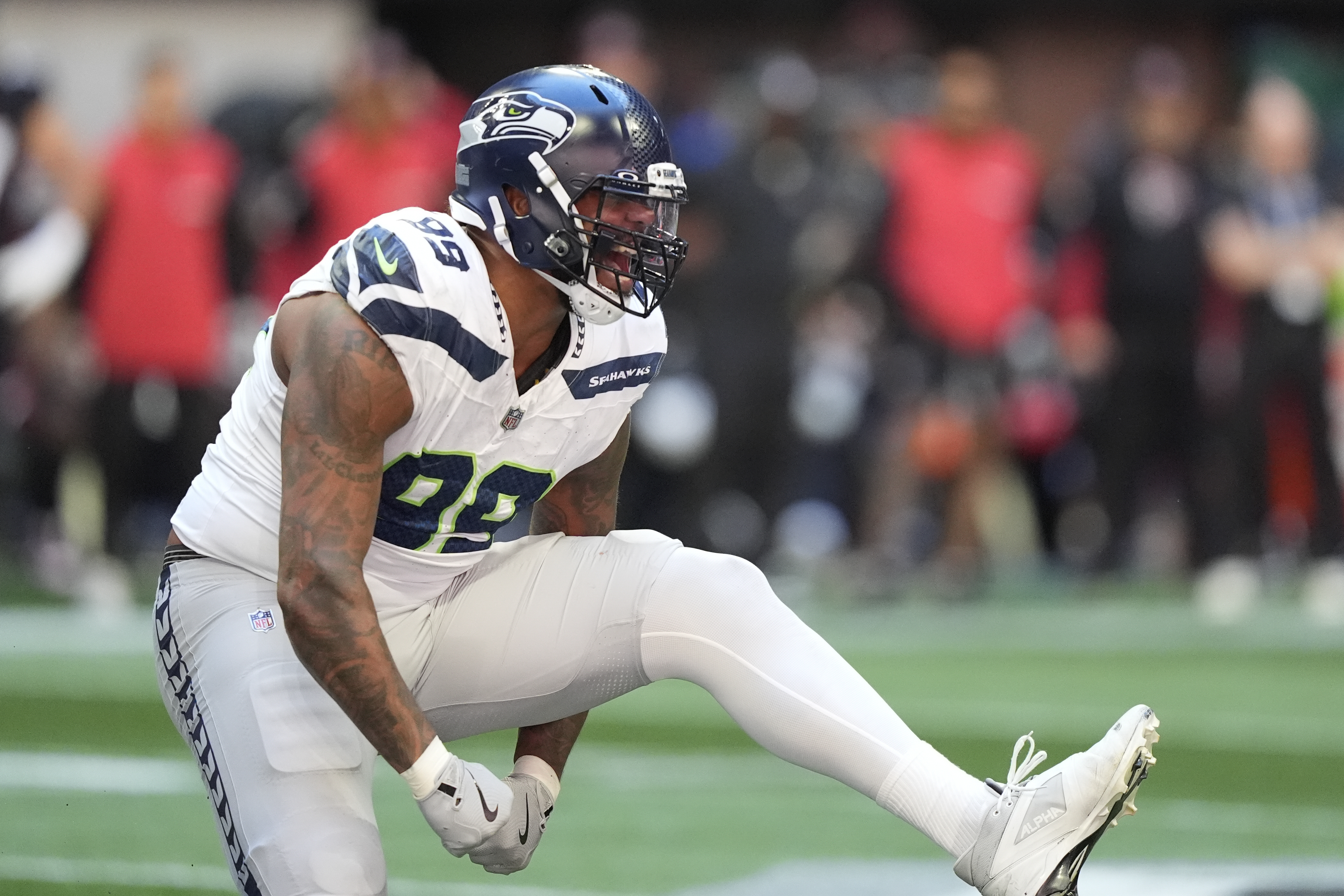 Seattle Seahawks defensive end Leonard Williams (99) reacts after sacking Atlanta Falcons quarterback Kirk Cousins during the first half of an NFL football game, Sunday, Oct. 20, 2024, in Atlanta. 