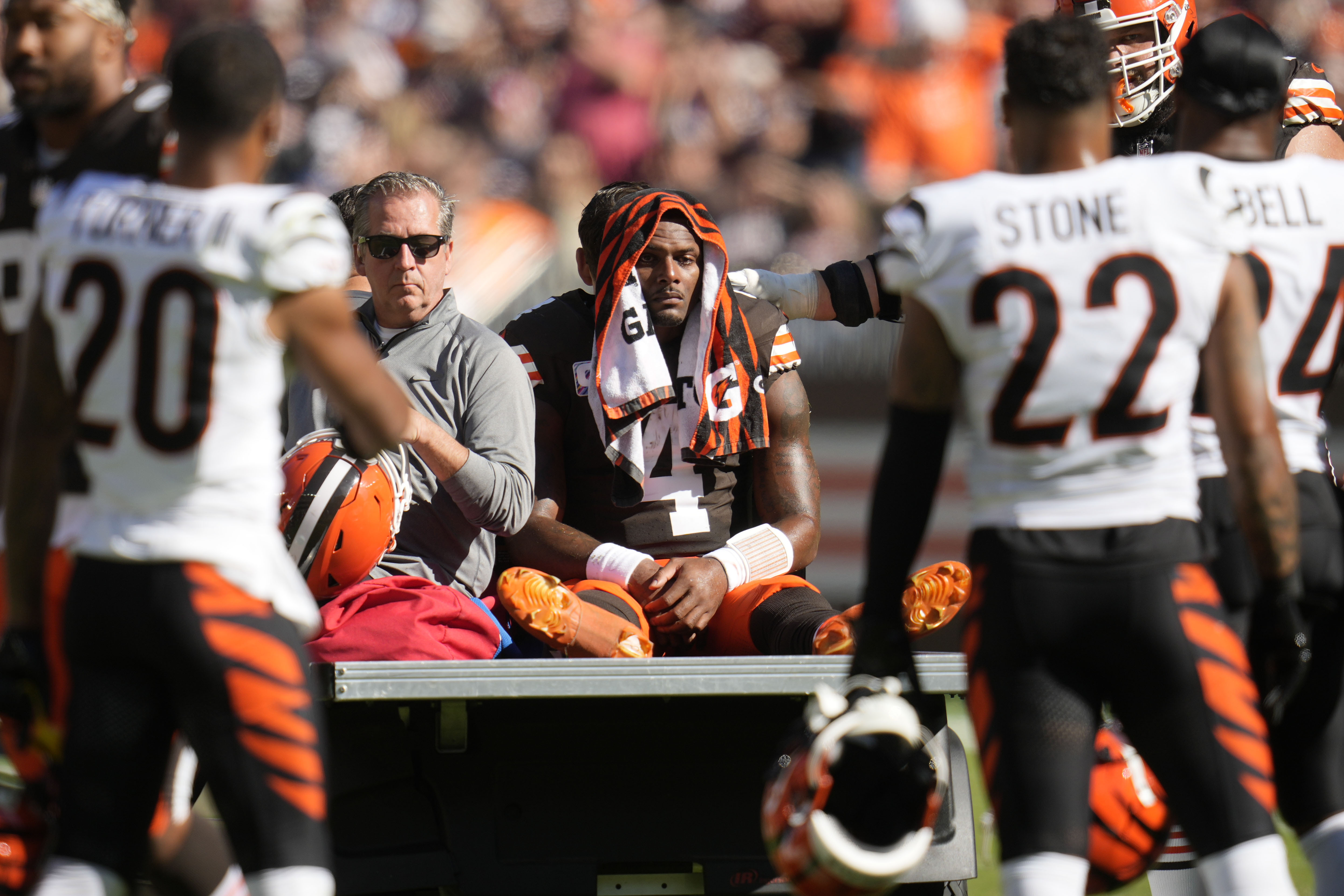 Cleveland Browns quarterback Deshaun Watson (4) is carted off the field after being injured in the first half of an NFL football game against the Cincinnati Bengals, Sunday, Oct. 20, 2024, in Cleveland. 