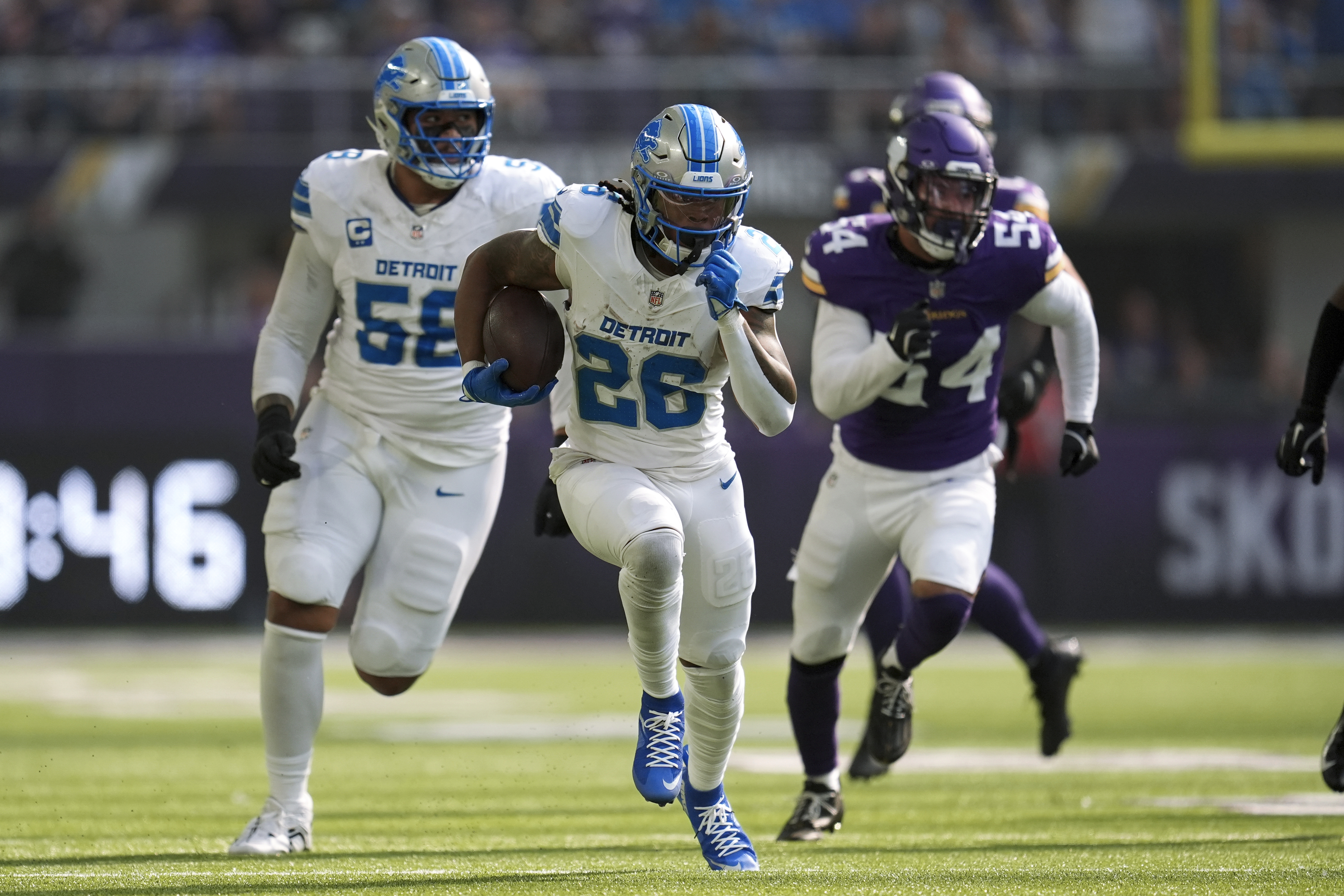 Detroit Lions running back Jahmyr Gibbs (26) runs for a 45-yard touchdown against the Minnesota Vikings during the first half of an NFL football game Sunday, Oct. 20, 2024, in Minneapolis.