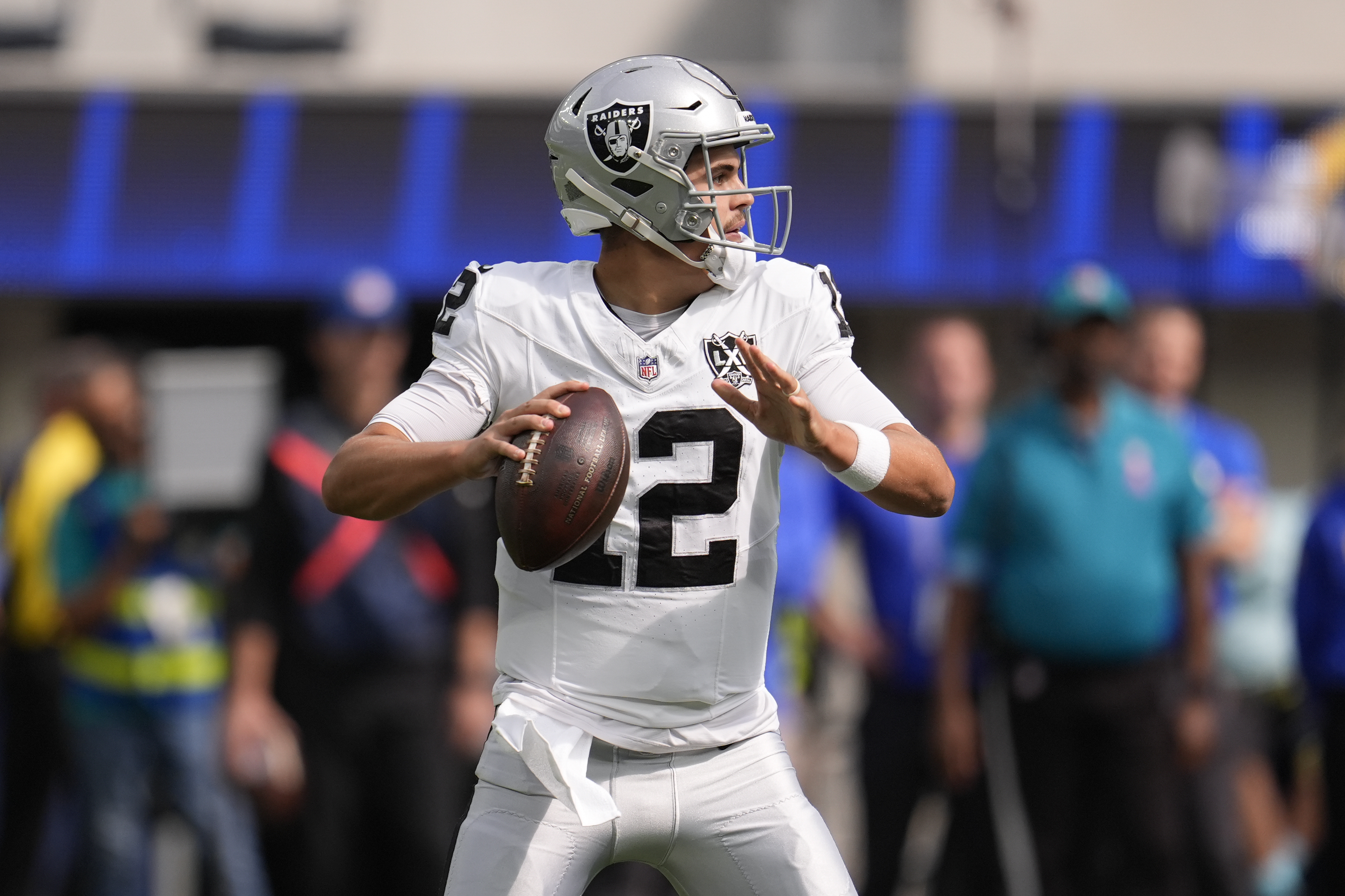 Las Vegas Raiders quarterback Aidan O'Connell (12) looks to pass during the first half of an NFL football game against the Los Angeles Rams, Sunday, Oct. 20, 2024, in Inglewood, Calif.