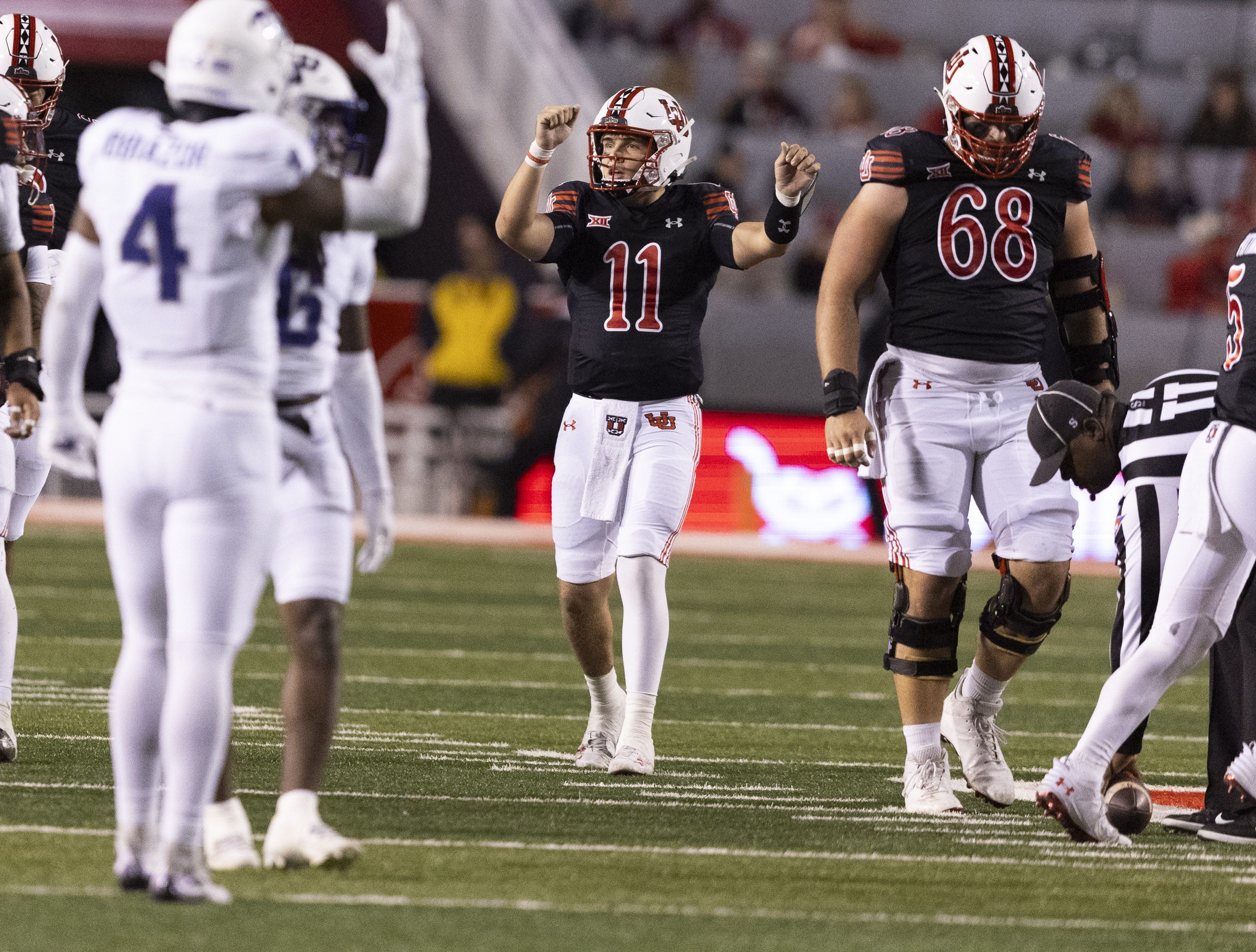 Utah Utes quarterback Isaac Wilson (11) signals to his teammates between plays during a game between the University of Utah and the TCU Horned Frogs at Rice-Eccles Stadium in Salt Lake City on Saturday, Oct. 19, 2024. The TCU Horned Frogs defeated the Utah Utes 13-7.