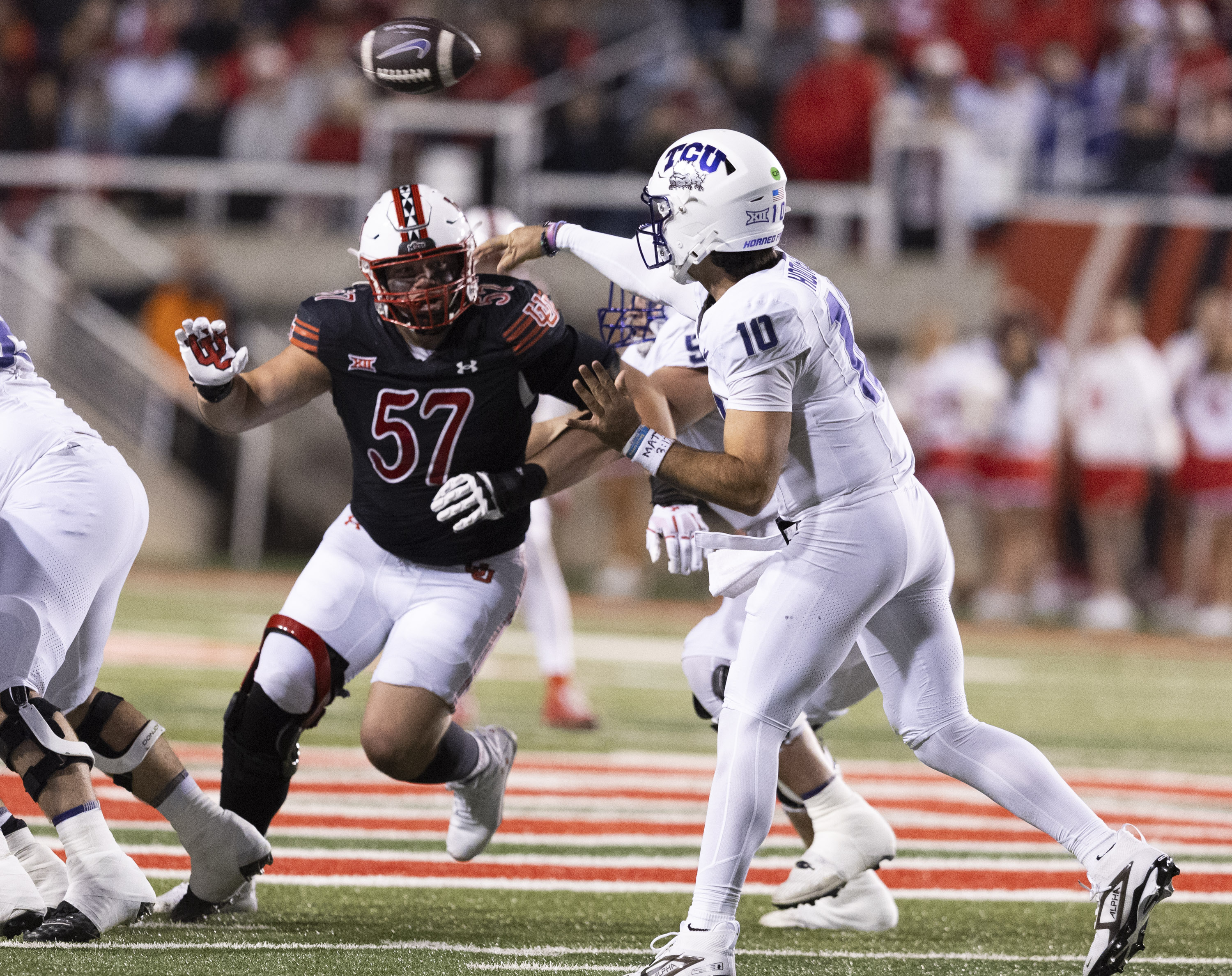 Utah defensive tackle Keanu Tanuvasa (57) rushes for TCU quarterback Josh Hoover (10) during a game between the University of Utah and the TCU Horned Frogs at Rice-Eccles Stadium in Salt Lake City on Saturday, Oct. 19, 2024. The TCU Horned Frogs defeated the Utah Utes 13-7.