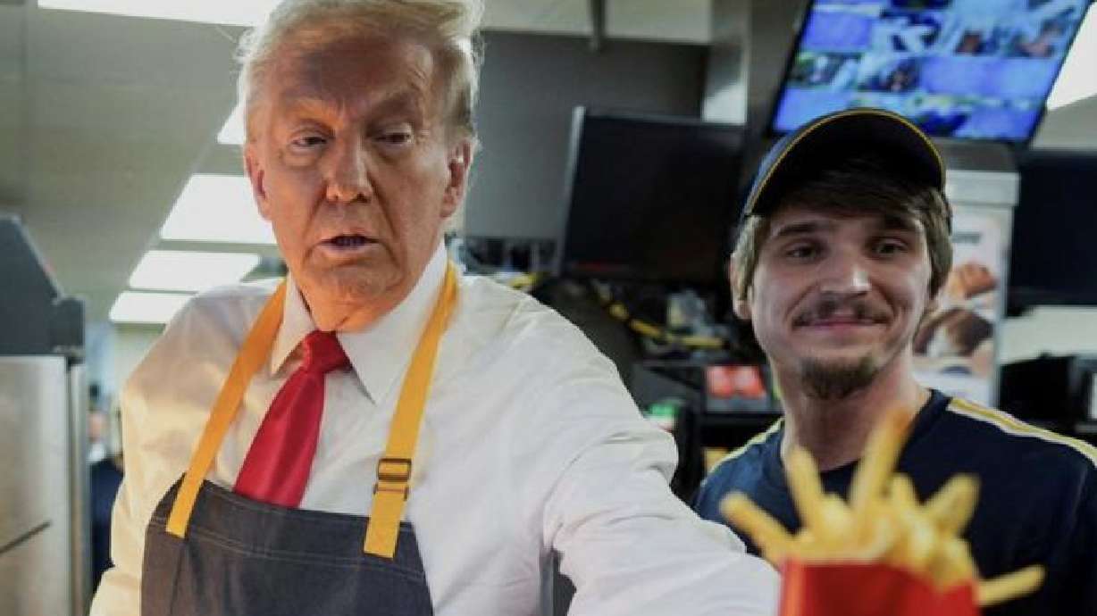 Republican presidential nominee and former President Donald Trump serves food at a McDonald's restaurant in Feasterville-Trevose, Pennsylvania, Sunday.