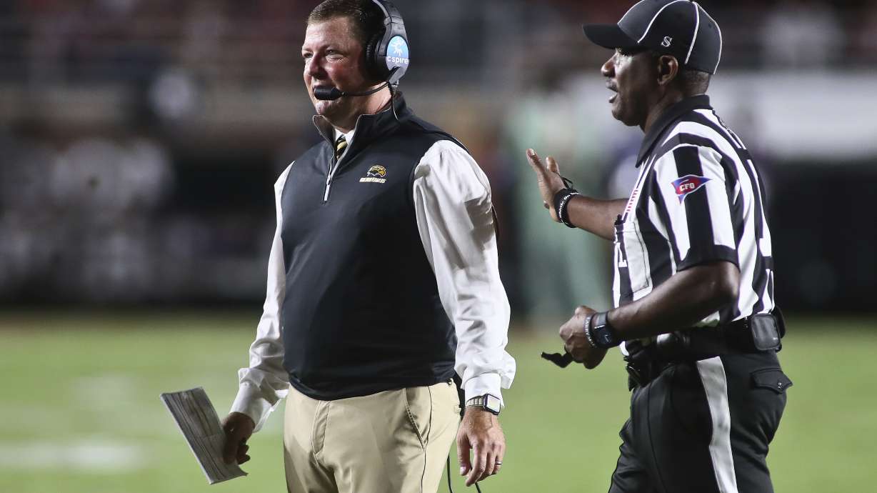 FILE - Southern Mississippi head coach Will Hall, left, walks back to the sideline after arguing with a referee in the first quarter of an NCAA college football game against Florida State Saturday, Sept. 9, 2023, in Tallahassee, Fla.