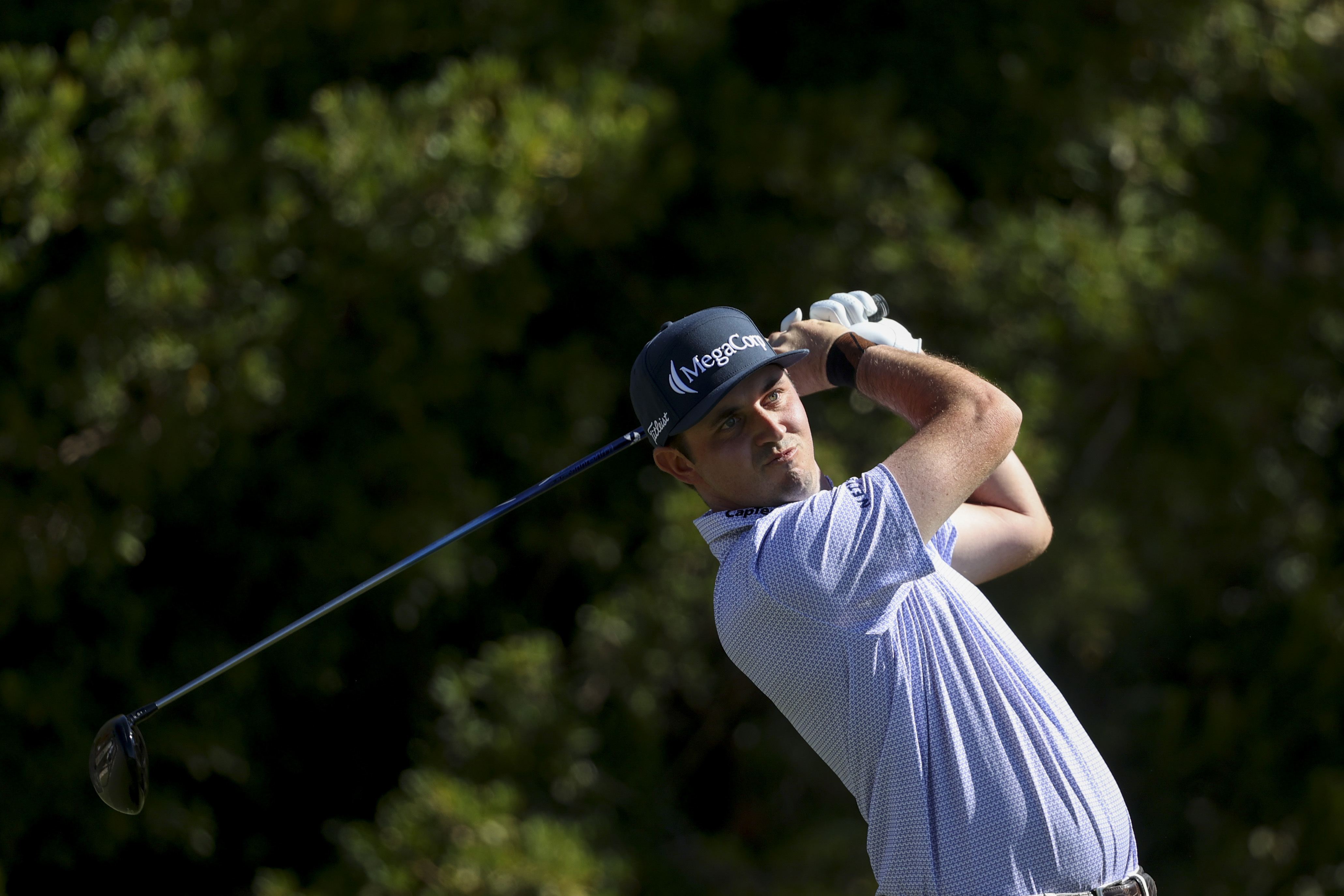 J.T. Poston hits off the tee on the third hole during the final round of the Shriners Children's Open golf tournament, Sunday, Oct. 20, 2024, in Las Vegas.