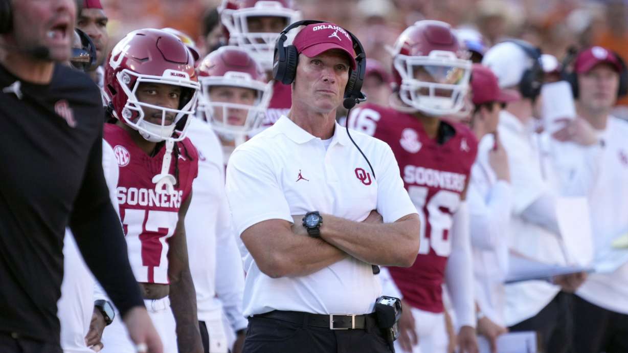 Oklahoma head football coach Brent Venables, center, watches play against Texas late in the second half of an NCAA college football game in Dallas, Saturday, Oct. 12, 2024.