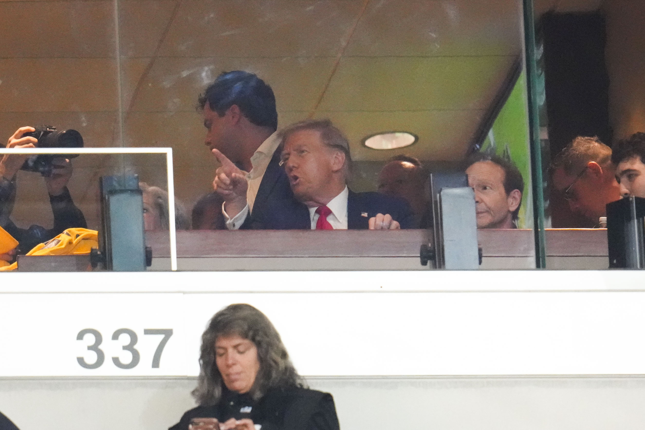 Republican presidential nominee former President Donald Trump watches the first half of an NFL football game between the Pittsburgh Steelers and the New York Jets in Pittsburgh, Sunday, Oct. 20, 2024. 