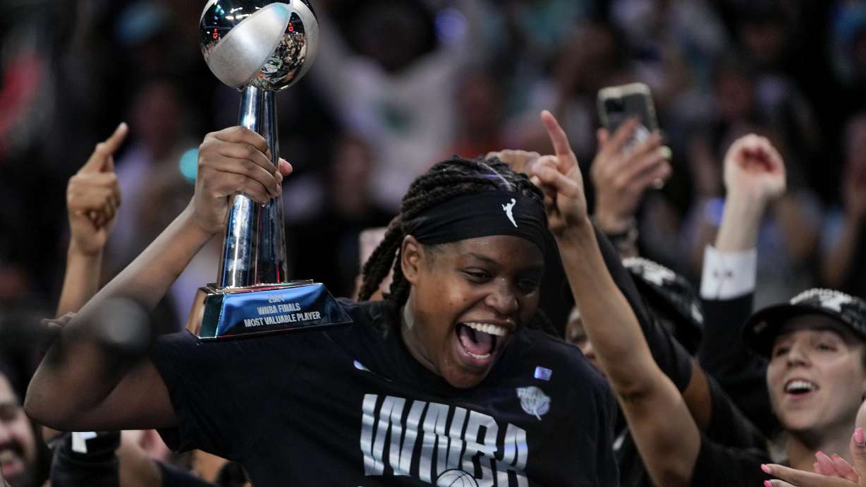 New York Liberty forward Jonquel Jones (35) reacts after being given the MVP Award after winning the championship against the Minnesota Lynx in Game 5 of the WNBA basketball final series, Sunday, Oct. 20, 2024, in New York.