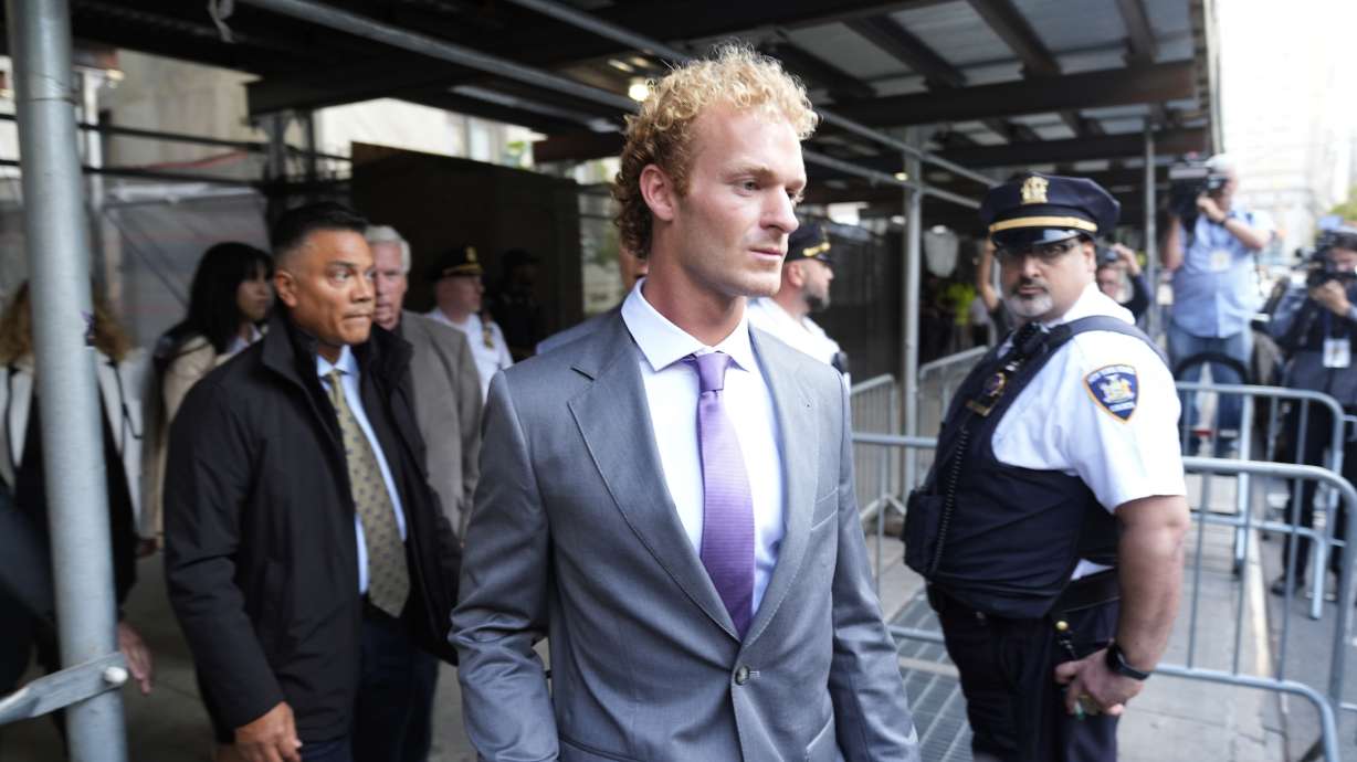 Daniel Penny, right, charged with manslaughter for placing a man in a deadly chokehold aboard a New York City subway train, departs Manhattan Criminal Court, Oct. 3 in New York. Jury selection was to begin Monday.
