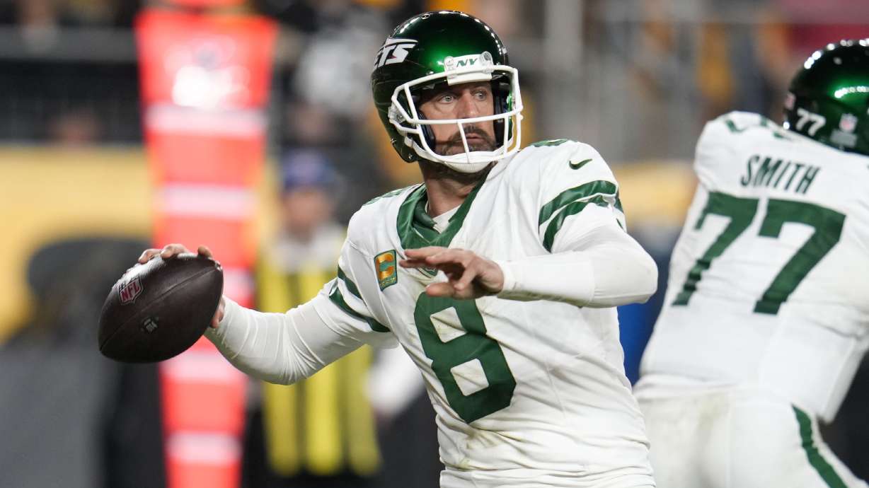 New York Jets quarterback Aaron Rodgers (8) passes in the first half of an NFL football game in Pittsburgh, Sunday, Oct. 20, 2024.