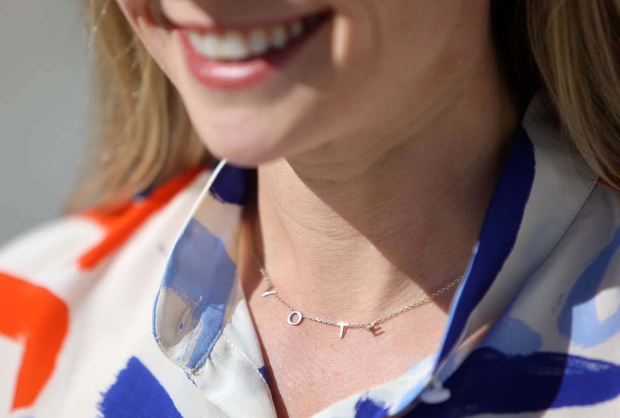 U.S. Senate candidate Caroline Gleich wears a VOTE necklace while posing for a portrait outside the Capitol in Salt Lake City on Oct. 16.