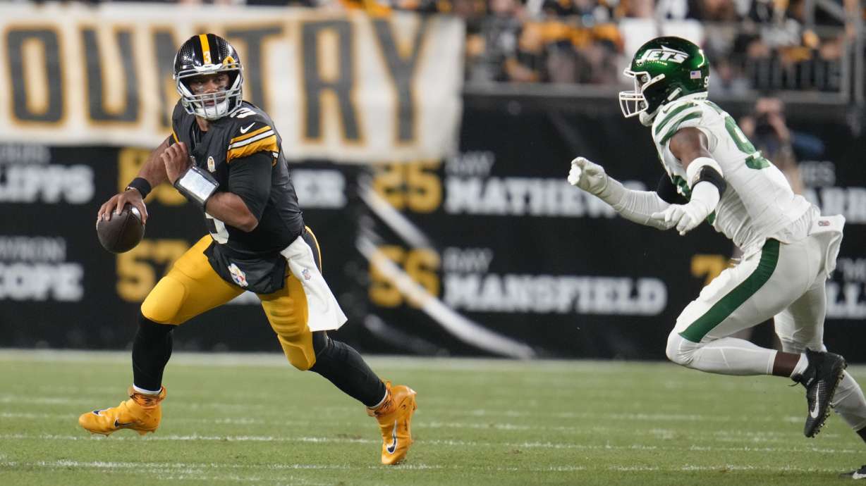 Pittsburgh Steelers quarterback Russell Wilson (3) scrambles in the first half of an NFL football game against the New York Jets in Pittsburgh, Sunday, Oct. 20, 2024.