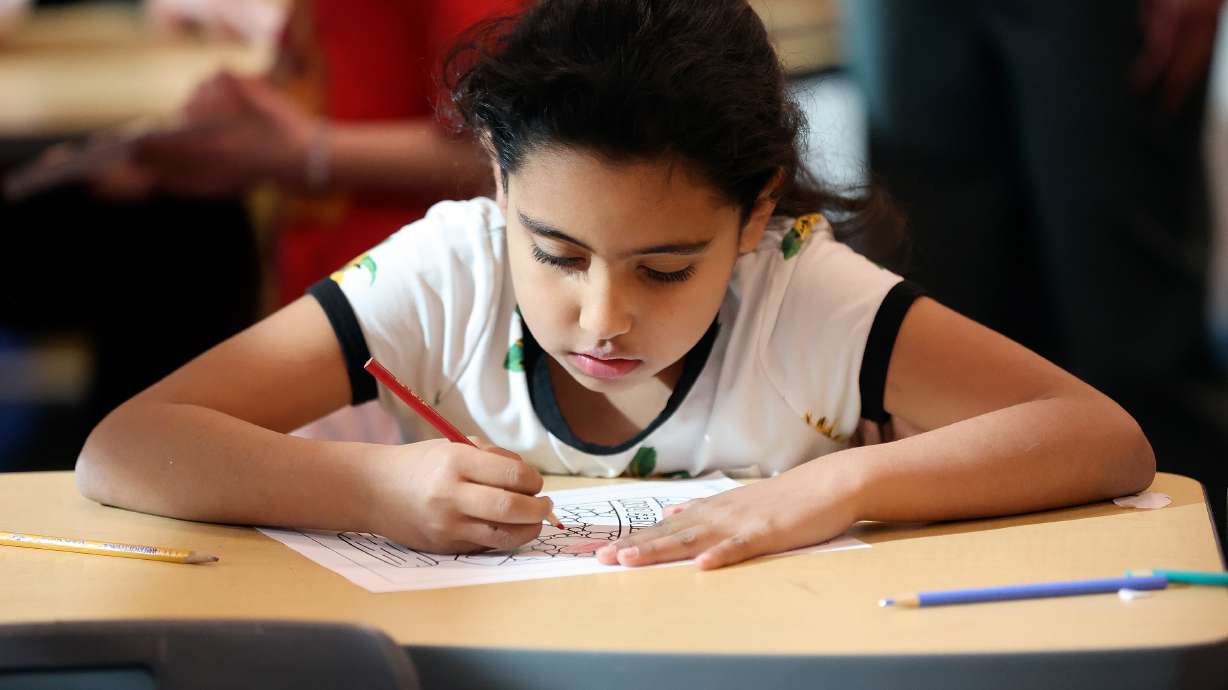 Second grader Alicia Lamas Arellano colors at South Kearns Elementary in Kearns on Jan. 30. Elementary enrollment counts have generally decreased over the last decade, while enrollment counts in secondary grades have increased.