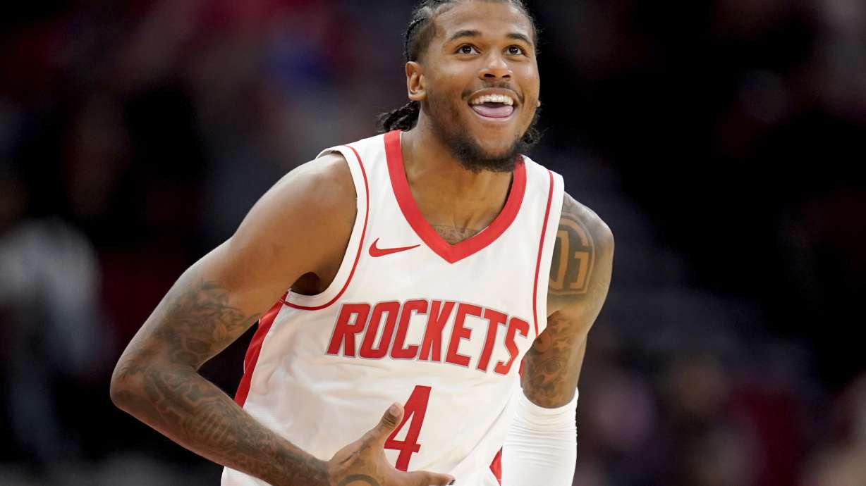 Houston Rockets guard Jalen Green (4) reacts after making a three point basket against the San Antonio Spurs during the second half of an NBA preseason basketball game Thursday, Oct. 17, 2024, in Houston.