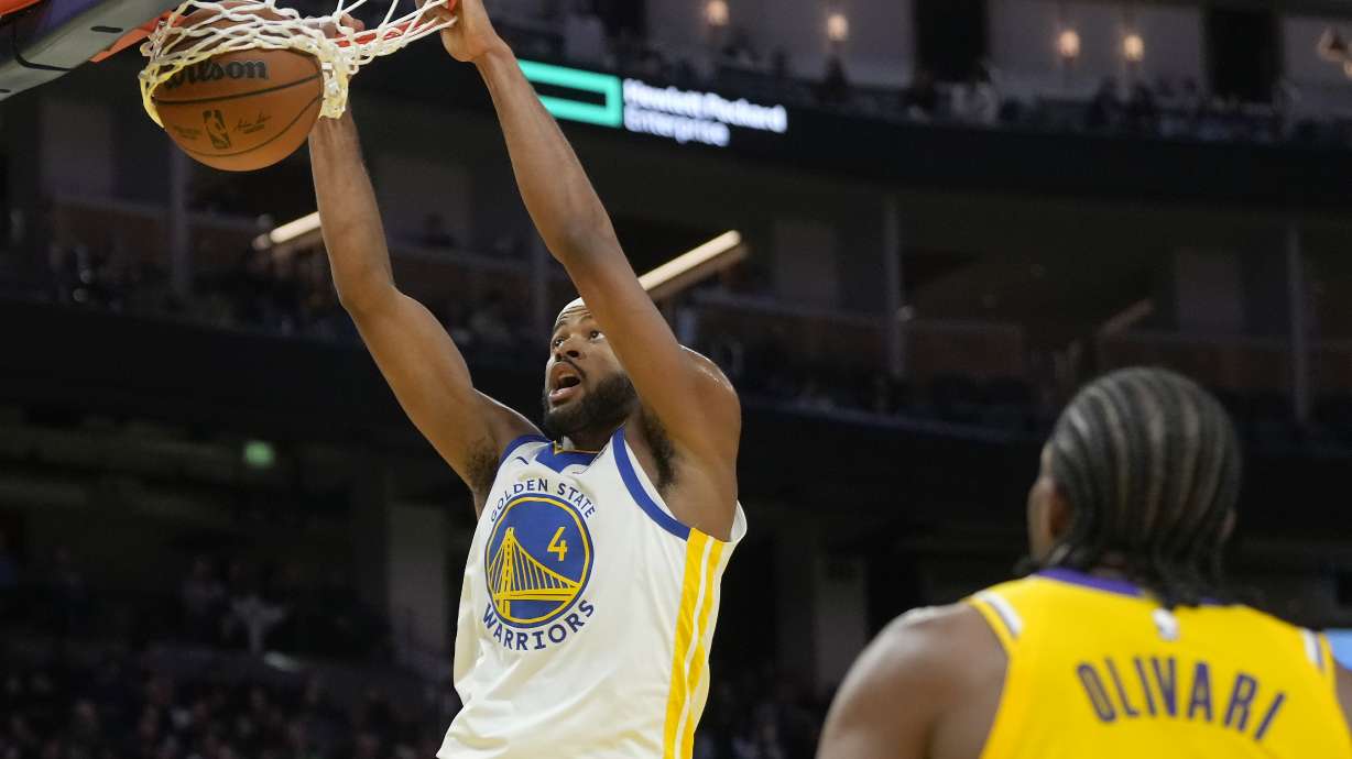Golden State Warriors guard Moses Moody dunks against the Los Angeles Lakers during the second half of an NBA preseason basketball game in San Francisco, Friday, Oct. 18, 2024.