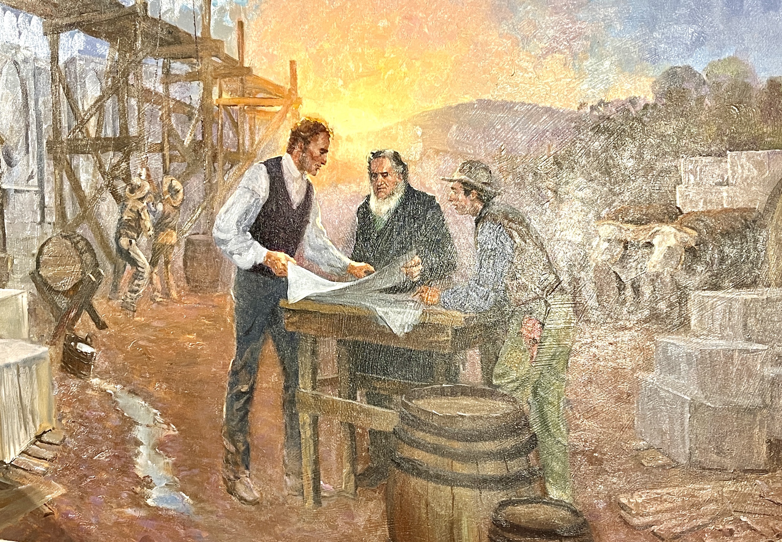 A painting depicting James Staples working on the Salt Lake Temple foundation is unveiled on Monday. His descendants say the painting will be loaned to museums for future display.