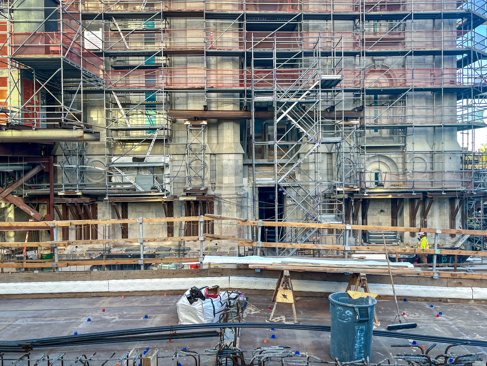 Construction crews work near the foundation of the Salt Lake Temple on Monday. Descendants of the original foundation's head on-site mason gathered Monday to celebrate his contributions as a new foundation is laid beneath the temple.