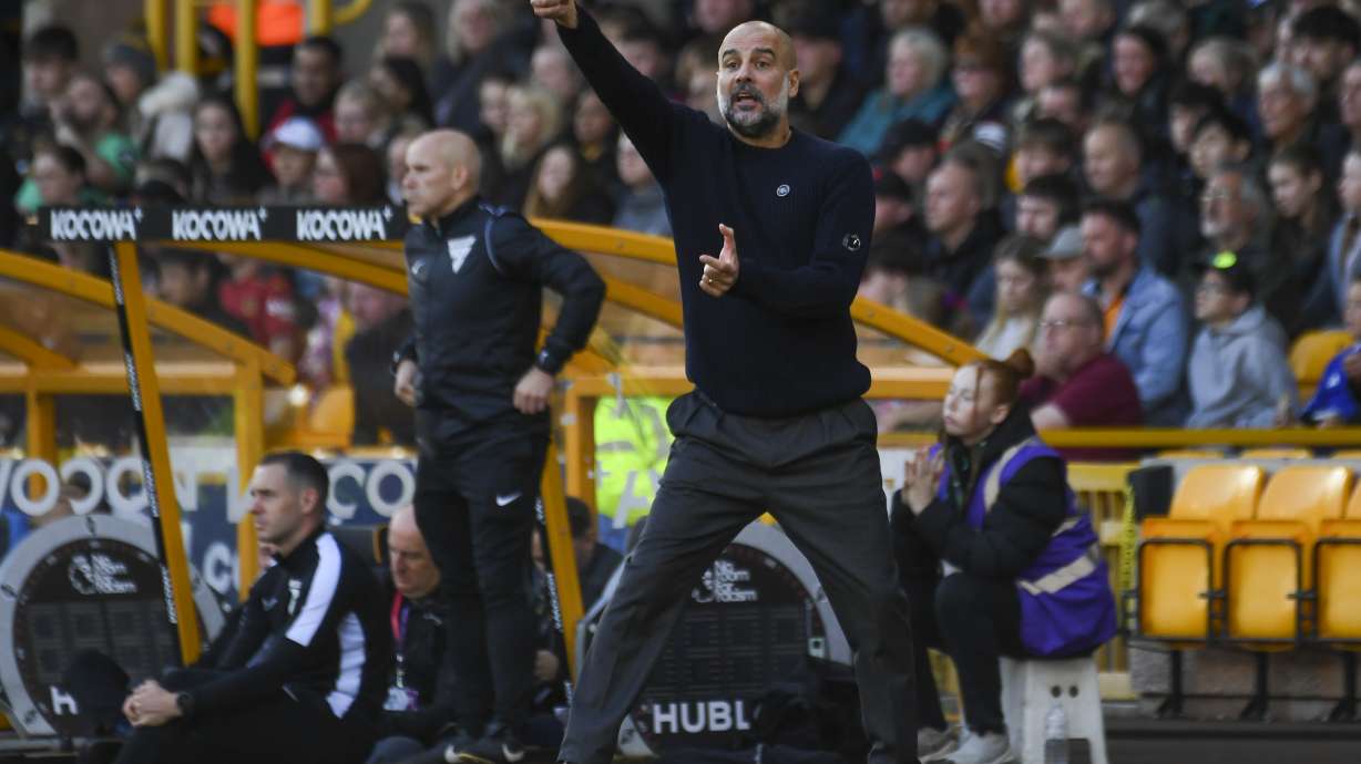 Manchester City's head coach Pep Guardiola gestures during the English Premier League soccer match between Wolverhampton Wanderers and Manchester City at the Molineux Stadium in Wolverhampton, England, Sunday, Oct. 20, 2024.