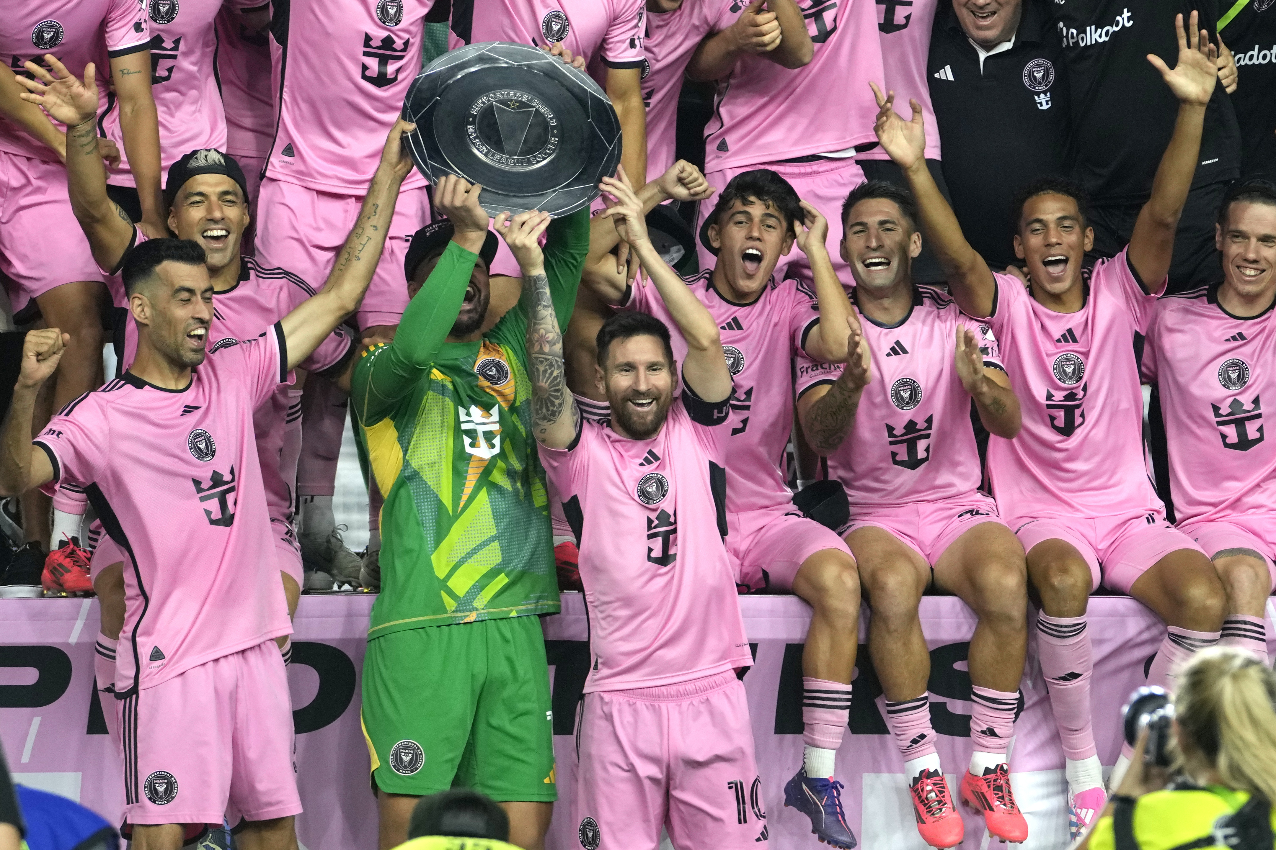 Inter Miami forward Lionel Messi (10) celebrates with his teammates during a ceremony for winning the Supporters' Shield after an MLS soccer match against the New England Revolution, Saturday, Oct. 19, 2024, in Fort Lauderdale, Fla. 