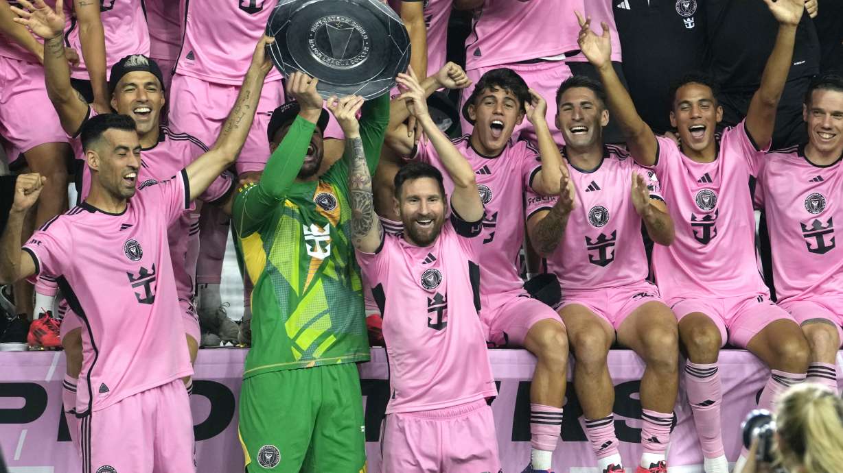 Inter Miami forward Lionel Messi (10) celebrates with his teammates during a ceremony for winning the Supporters' Shield after an MLS soccer match against the New England Revolution, Saturday, Oct. 19, 2024, in Fort Lauderdale, Fla.