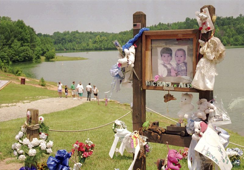 In a July 9, 1995, photo, visitors walk down the ramp where Alex and Michael Smith were drowned in a car in 1994 in Union, S.C., by their mother, Susan Smith.