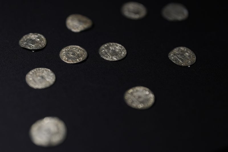 A selection of coins, part of the Chew Valley Hoard of 2,584 coins, buried in the turmoil following the Norman Invasion of Britain in 1066, is on display at the British Museum in London, Tuesday. The hoard is valued at $5.58 million, a record find.