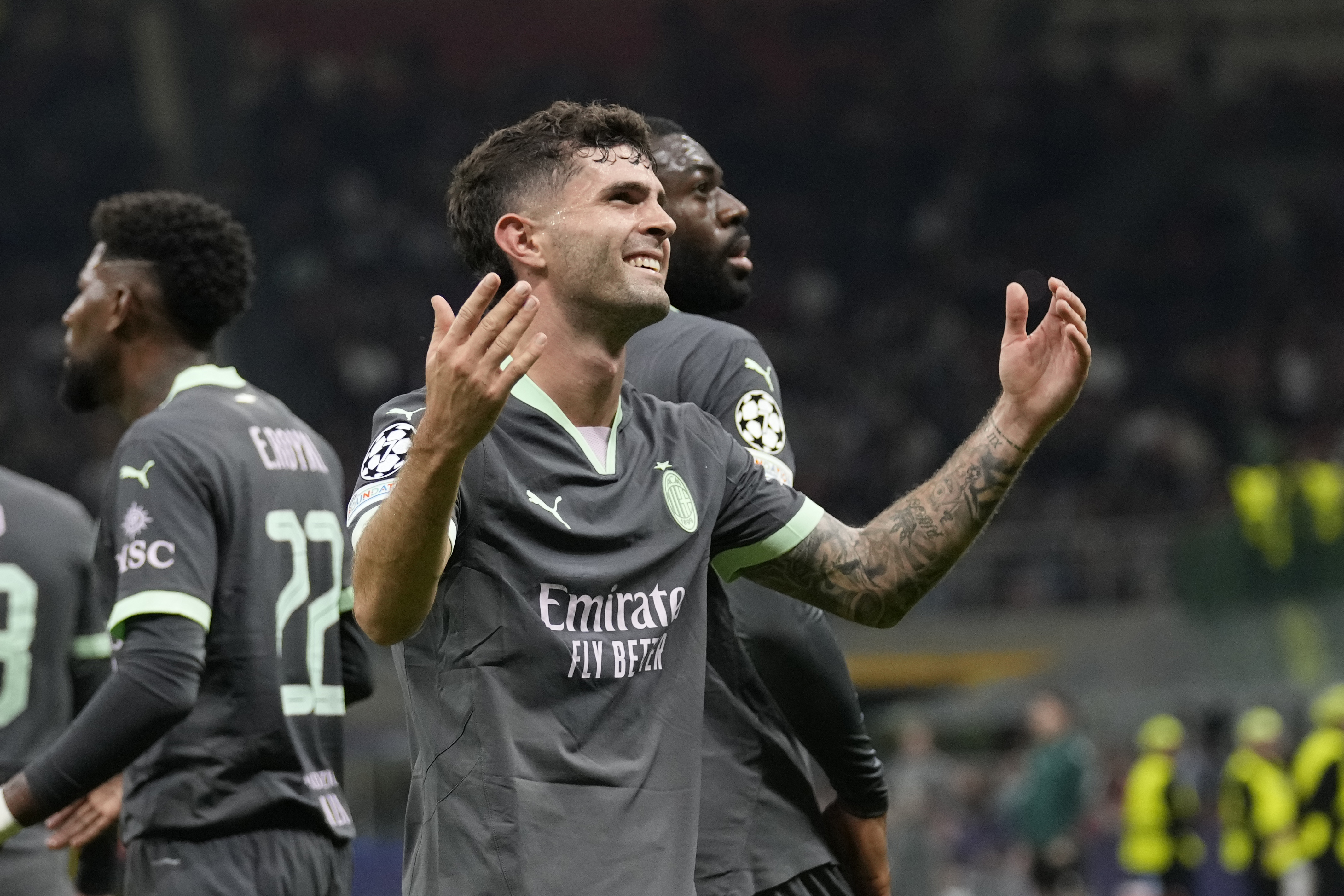 AC Milan's Christian Pulisic reacts after scoring the opening goal of his team during the Champions League opening phase soccer match between AC Milan and Club Brugge at the San Siro stadium in Milan, Italy, Tuesday, Oct. 22, 2024. 