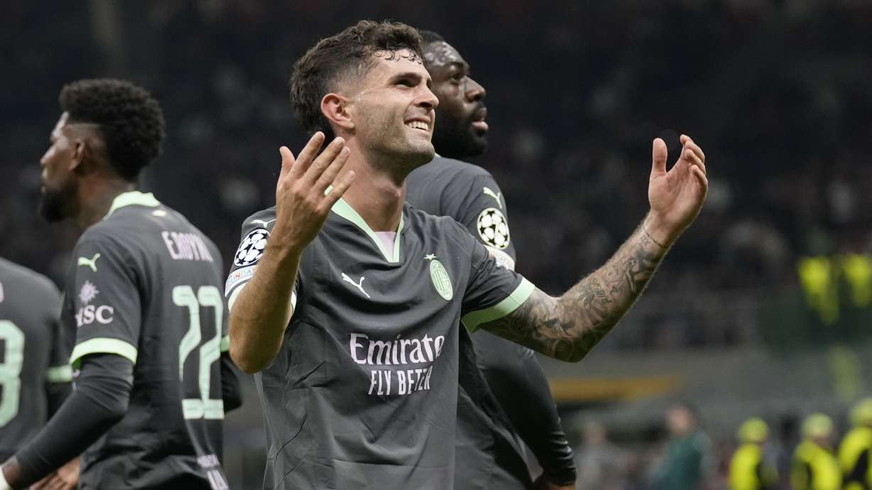 AC Milan's Christian Pulisic reacts after scoring the opening goal of his team during the Champions League opening phase soccer match between AC Milan and Club Brugge at the San Siro stadium in Milan, Italy, Tuesday, Oct. 22, 2024.