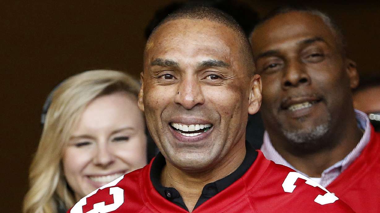 FILE - Former San Francisco 49ers running back Roger Craig smiles during an NFL football game between the San Francisco 49ers and the Cincinnati Bengals in Santa Clara, Calif., Sunday, Dec. 20, 2015.