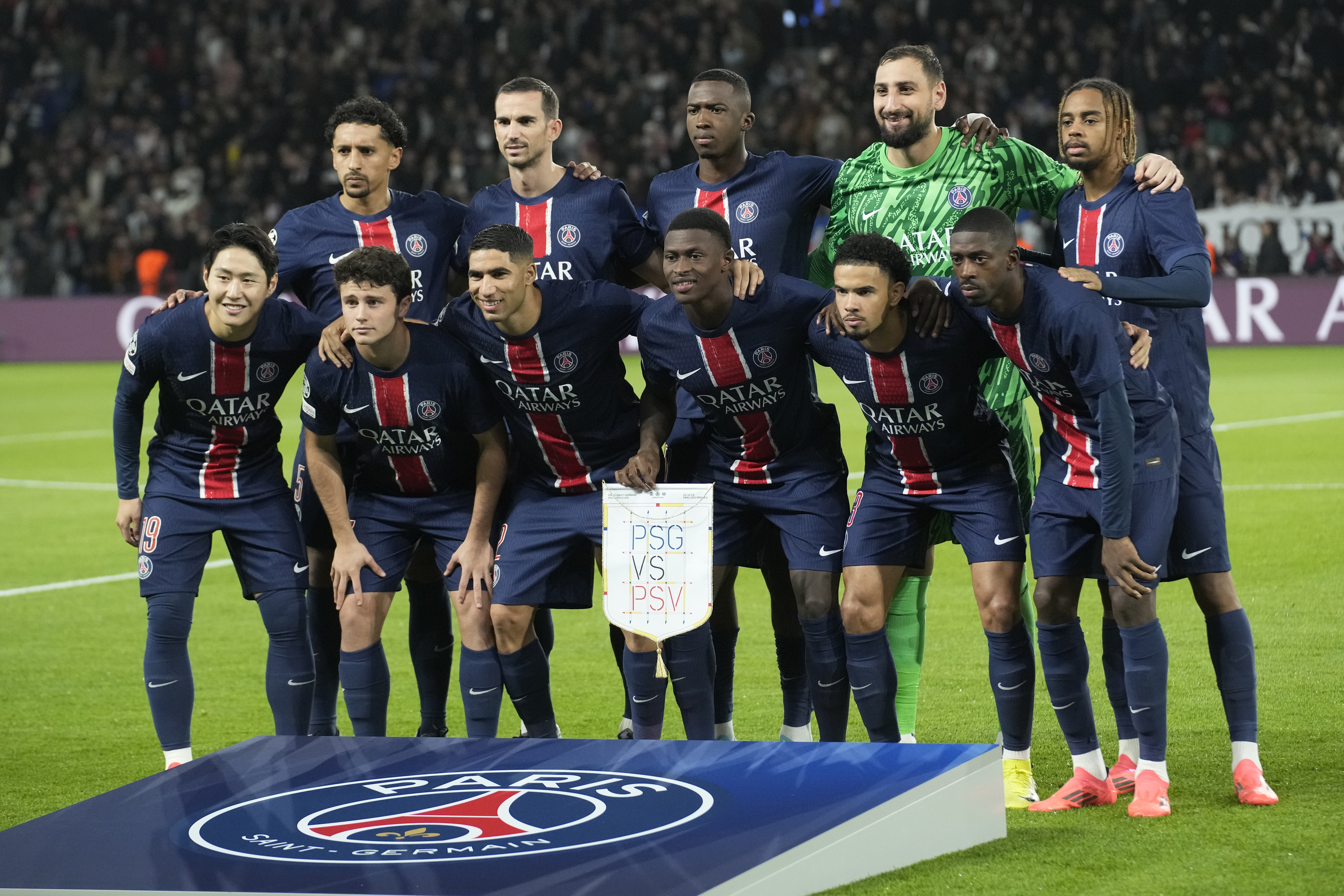 PSG players pose prior to the Champions League opening phase soccer match between Paris Saint-Germain and PSV Eindhoven at the Parc des Princes stadium in Paris, France, Tuesday, Oct. 22, 2024. 