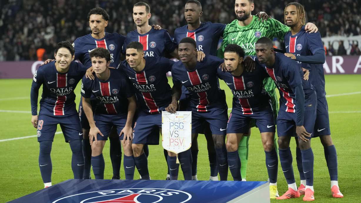 PSG players pose prior to the Champions League opening phase soccer match between Paris Saint-Germain and PSV Eindhoven at the Parc des Princes stadium in Paris, France, Tuesday, Oct. 22, 2024.