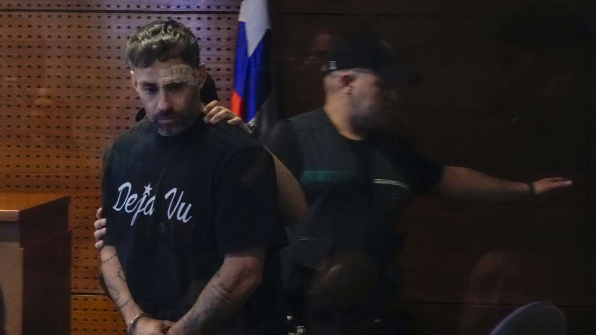 Former Chilean soccer player Jorge Valdivia is presented to the judge in handcuffs during his preliminary hearing for alleged sexual assault at a court in Santiago, Chile, Tuesday, Oct. 22, 2024.
