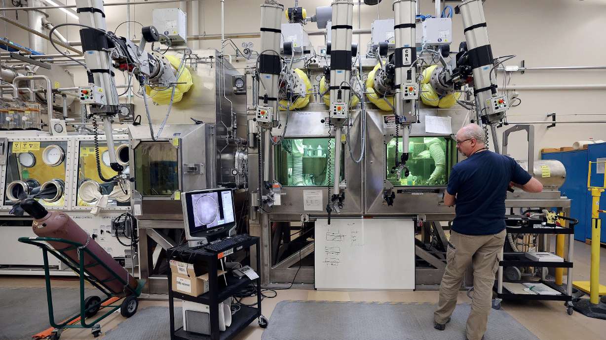 Scott Anderson prepares samples in the Materials and Fuels Complex at the Idaho National Laboratory in a remote area west of Idaho Falls on April 5, 2023. An initiative seeks to combine the efforts of eight states for advancing nuclear energy plans.