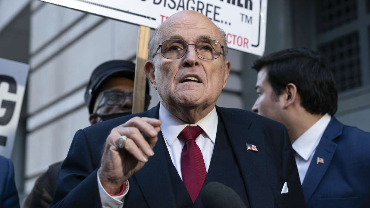 Rudy Giuliani speaks during a news conference outside federal court in Washington, Dec. 15, 2023. Giuliani has been ordered to turn over his New York apartment and various other assets to two Georgia election workers who won a $148 million defamation judgment against him.