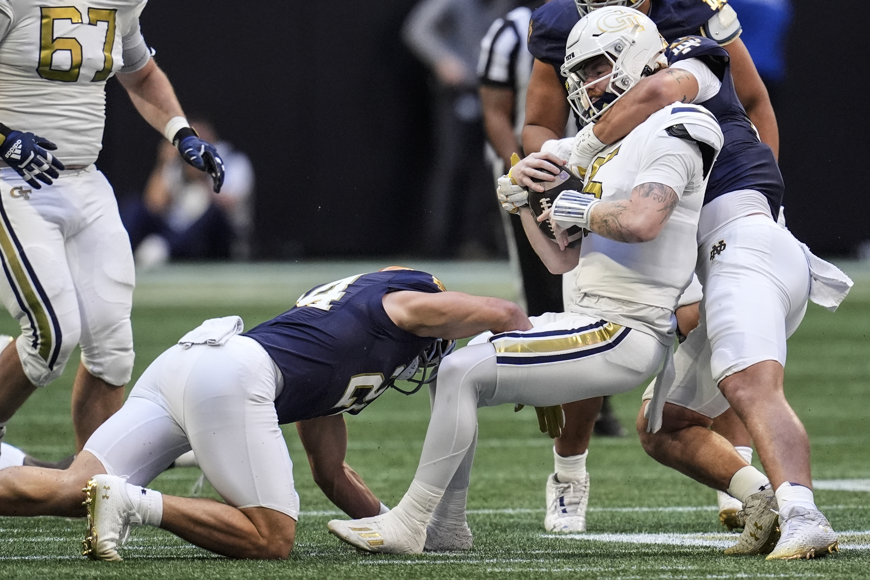 Georgia Tech quarterback Zach Pyron (5) is hit by against Notre Dames during the first half of an NCAA college football game, Saturday, Oct. 19, 2024, in Atlanta. 
