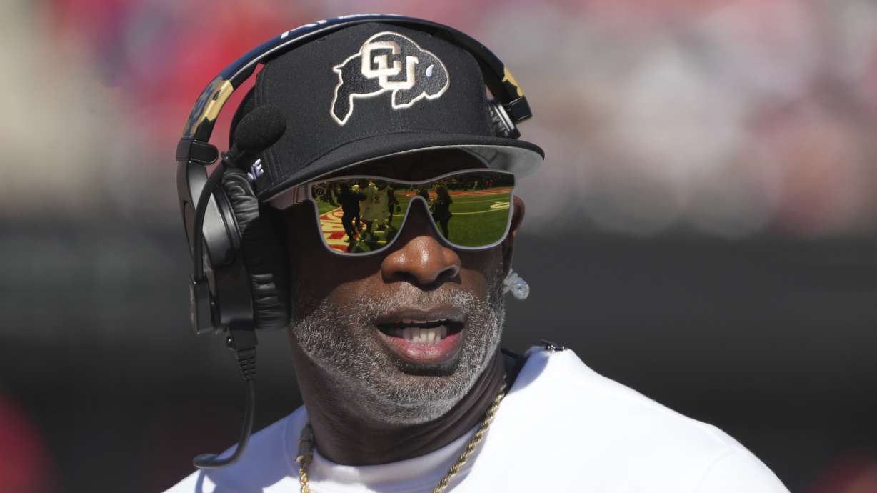 Colorado head coach Deion Sanders watches the replay in the first half during an NCAA college football game against Arizona, Saturday, Oct. 19, 2024, in Tucson, Ariz.