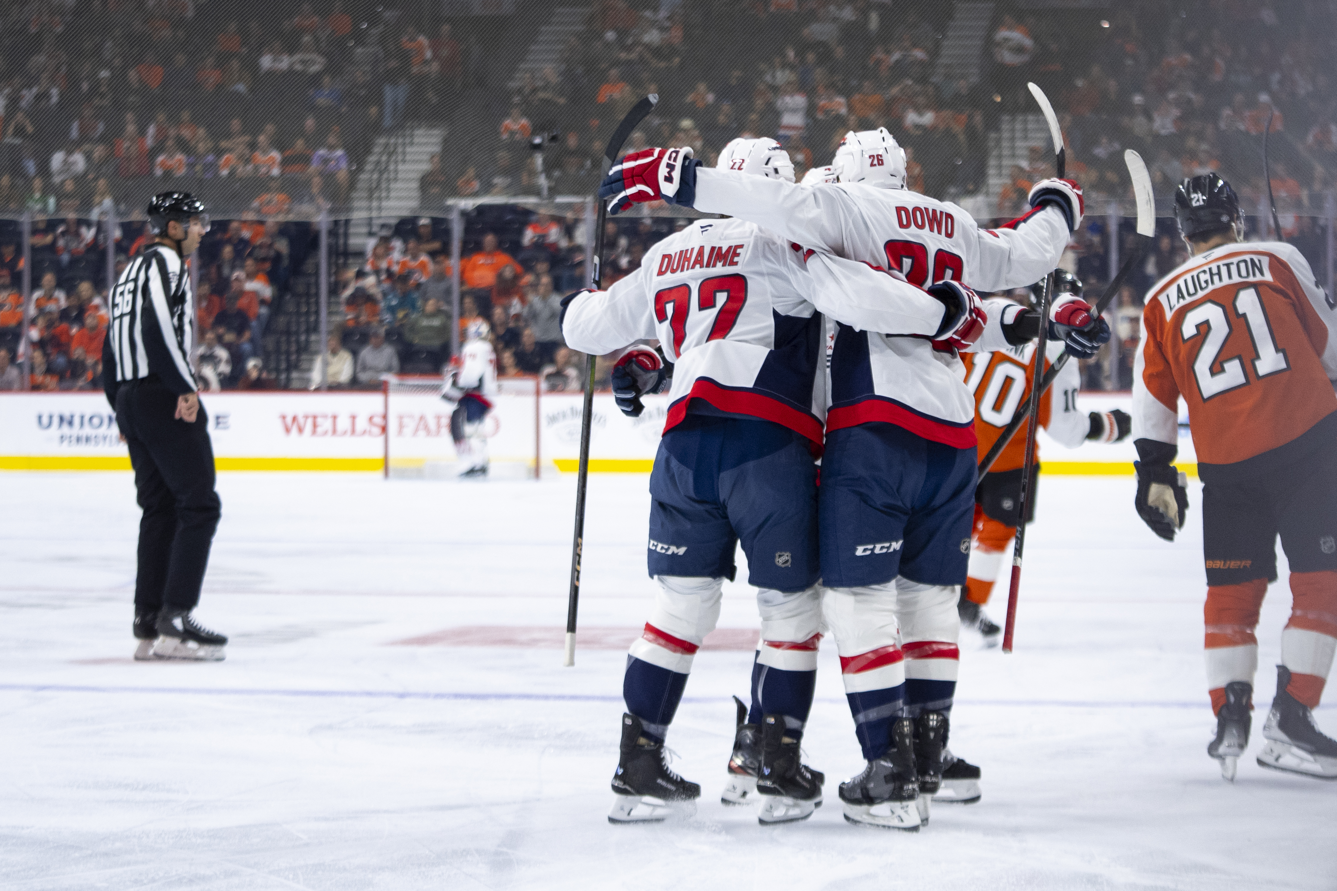 Washington Capitals' Nic Dowd, center, celebrates his goal with teammates during the first period of an NHL hockey game against the Philadelphia Flyers, Tuesday, Oct. 22, 2024, in Philadelphia. 