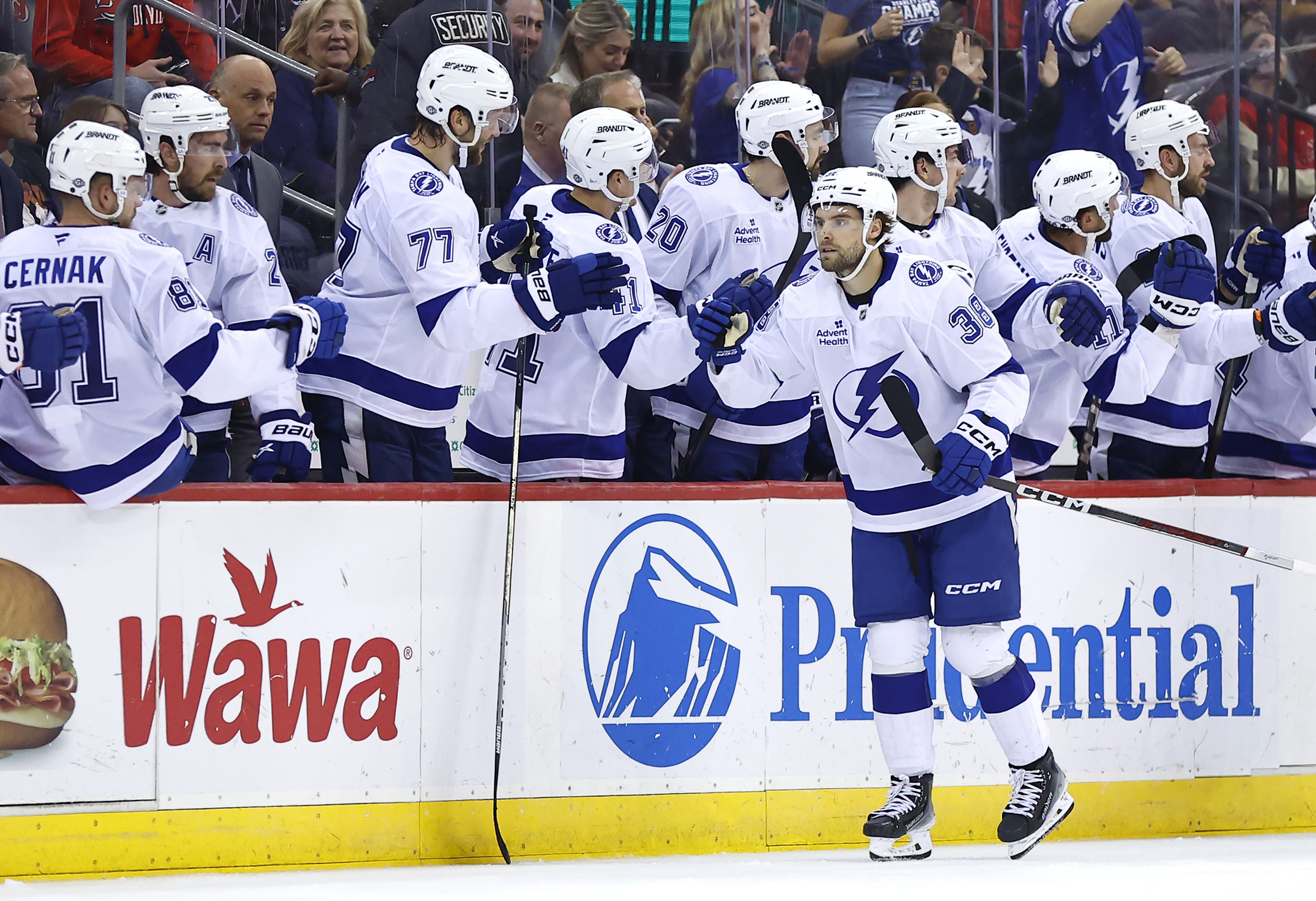 Tampa Bay Lightning left wing Brandon Hagel (38) celebrates with teammates after scoring a goal against the New Jersey Devils during the second period of a NHL hockey game, Tuesday Oct. 22, 2024, in Newark, N.J.