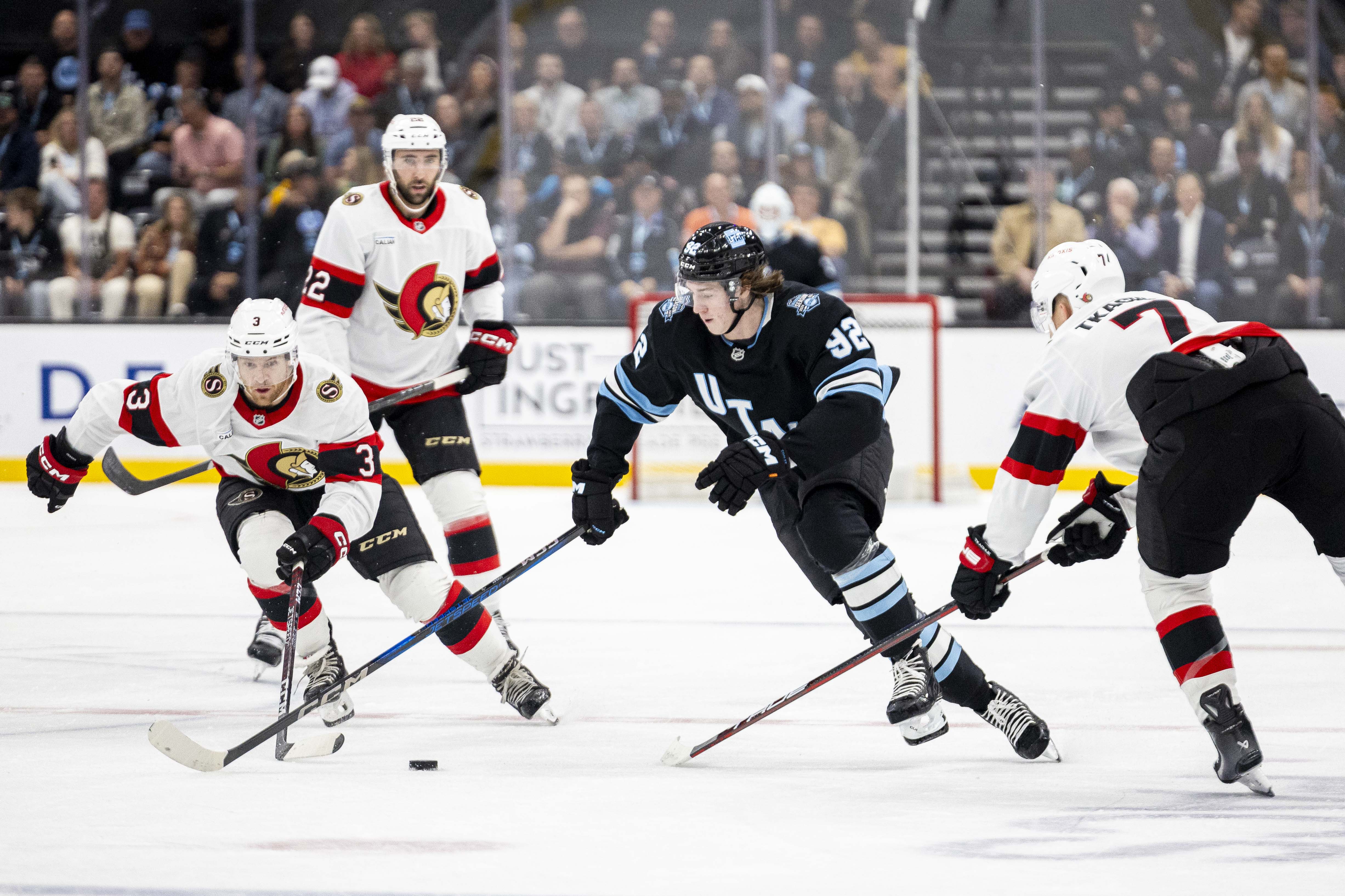 Utah Hockey Club center Logan Cooley (92) drives the puck up the ice against the Ottawa Senators during the first period of an NHL hockey game held at the Delta Center in Salt Lake City on Tuesday, Oct. 22, 2024.