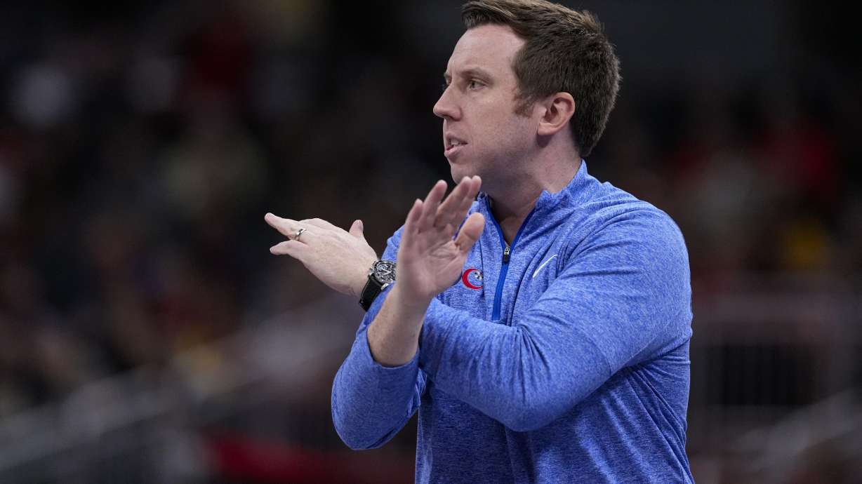 FILE - Washington Mystics head coach Eric Thibault signals to his team as they play against the Indiana Fever in the first half of a WNBA basketball game in Indianapolis, July 10, 2024.