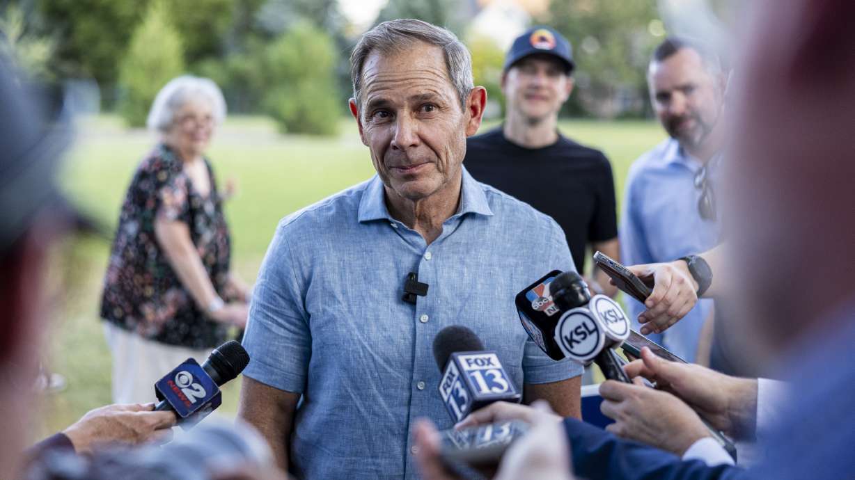 John Curtis talks with members of the media at Riverview Park in Provo on June 25. Curtis has been at the center of a sea change in conservative climate politics, and hopes to continue his approach in the U.S. Senate.