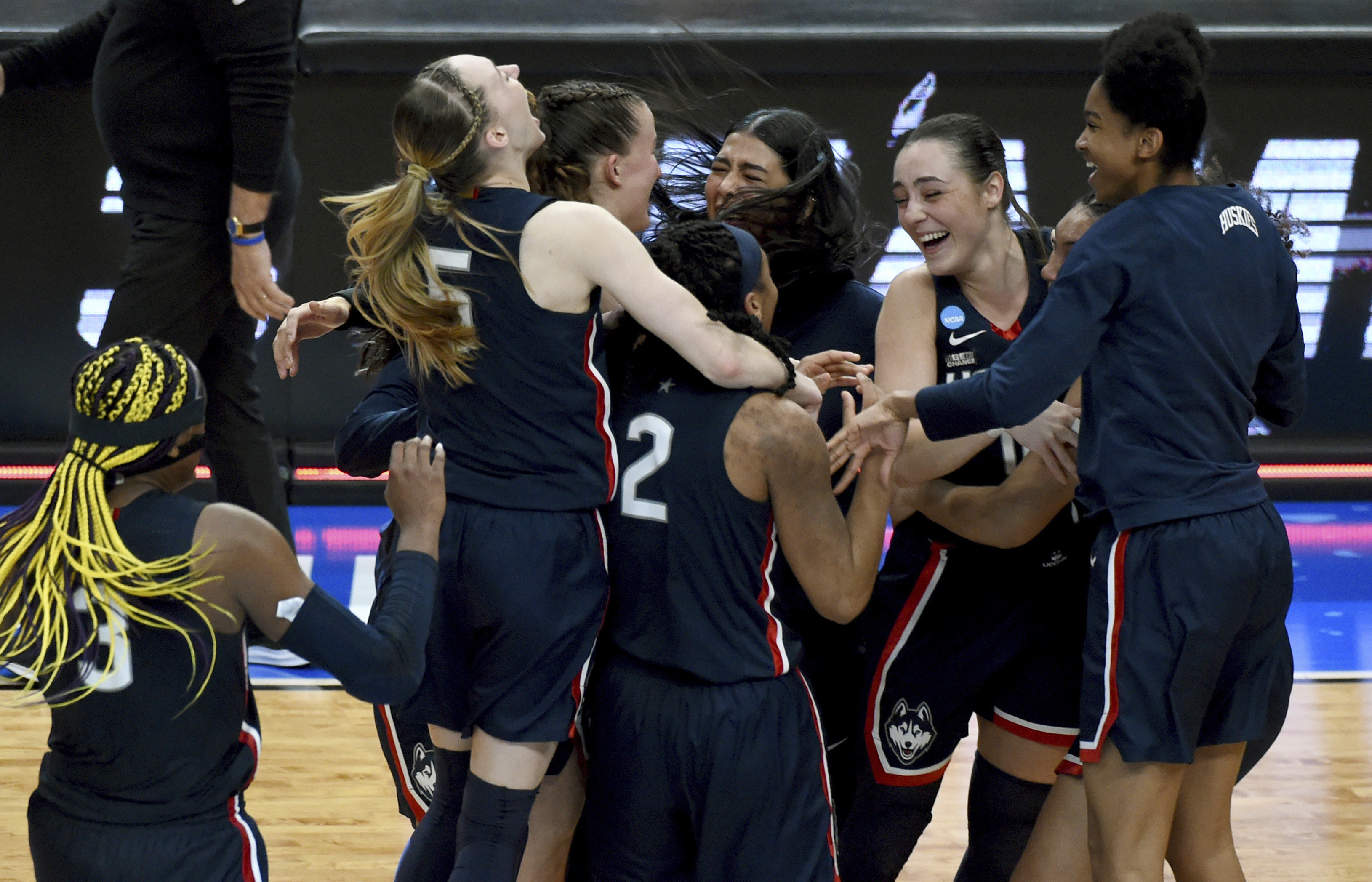 FILE - The UConn team celebrates after winning an Elite Eight college basketball game against Southern California in the women's NCAA Tournament, April 1, 2024, in Portland, Ore. 