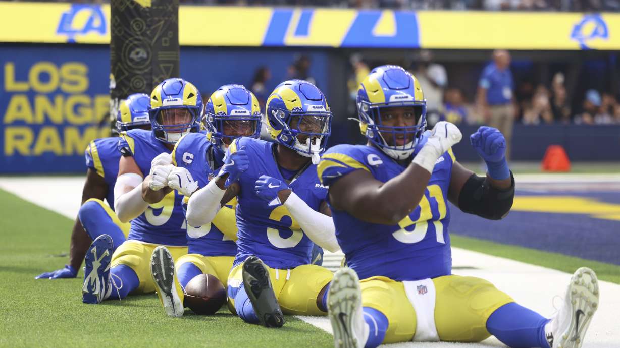 Los Angeles Rams players celebrate a fumble returned for a defensive touchdown by safety Kamren Curl (3) during the second half of an NFL football game against the Las Vegas Raiders, Sunday, Oct. 20, 2024, in Inglewood, Calif.
