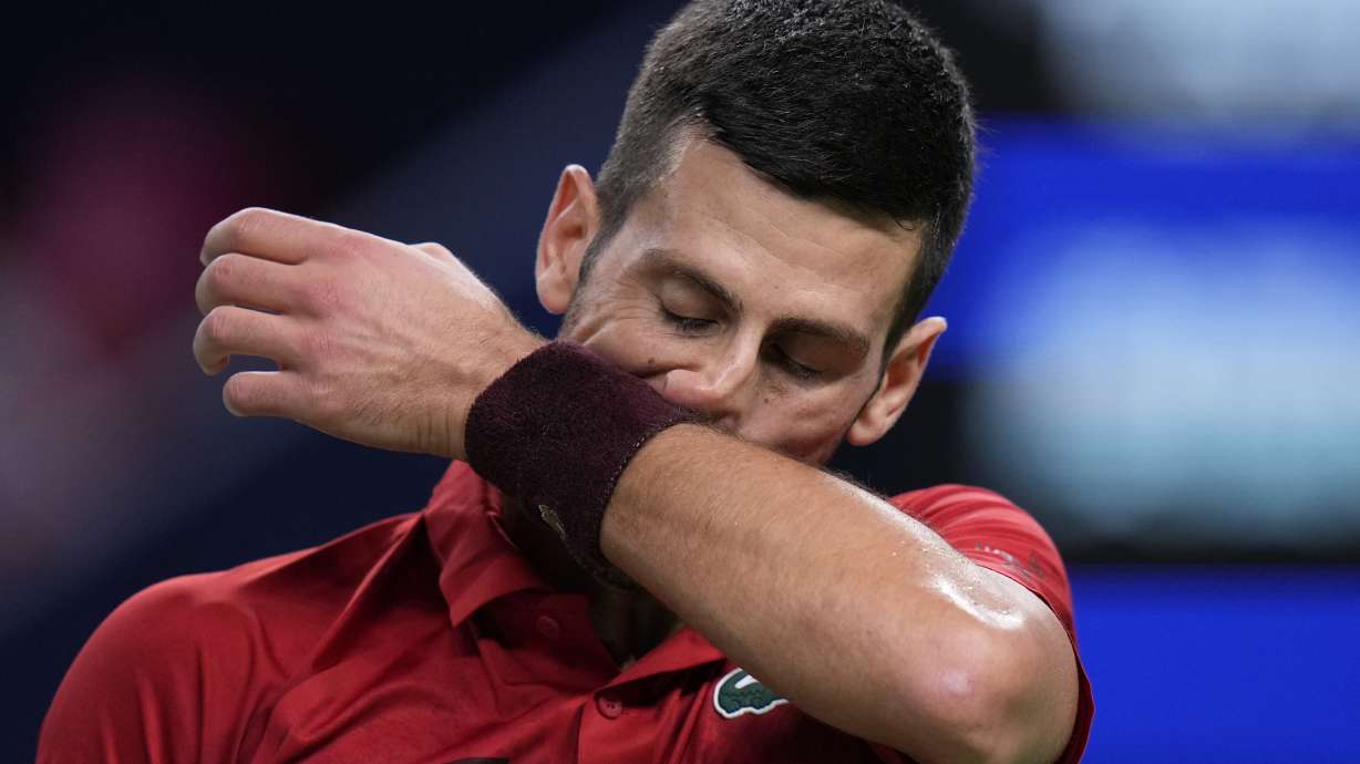 Novak Djokovic of Serbia reacts during the men's singles finals match against Jannik Sinner of Italy in the Shanghai Masters tennis tournament at Qizhong Forest Sports City Tennis Center in Shanghai, China, Sunday, Oct. 13, 2024.