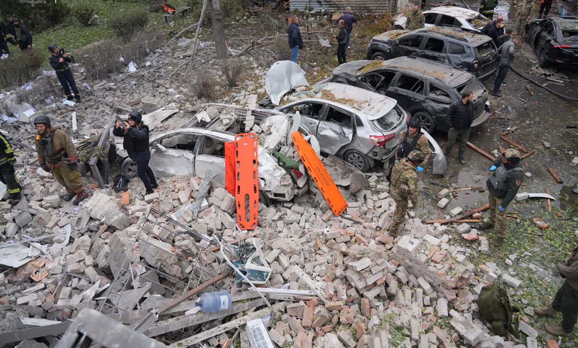 Emergency workers clear the rubble after Russia attacked the city with guided bombs overnight in Zaporizhzhia, Ukraine, Monday.