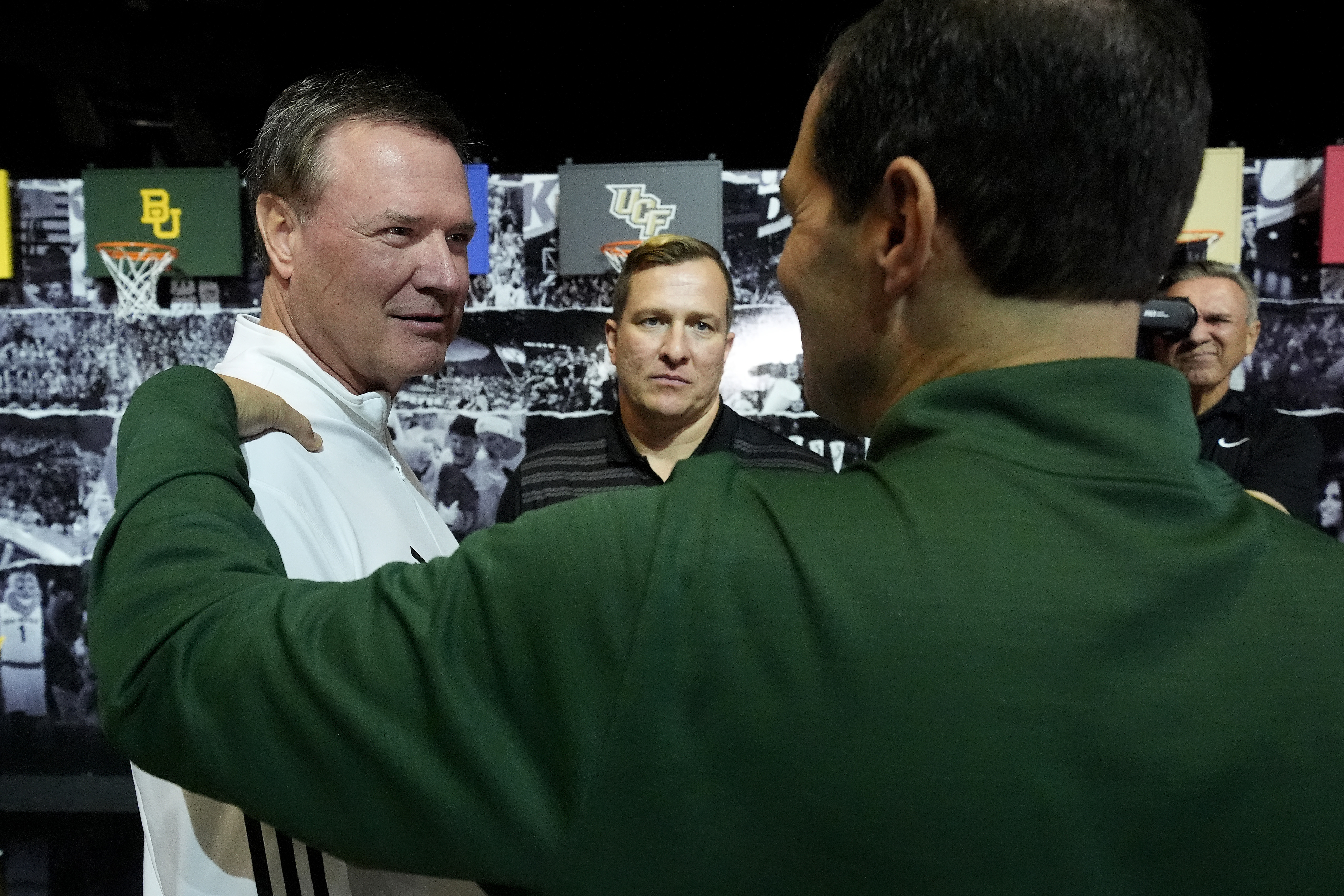 Kansas head coach Bill Self, left, talks with Iowa State head coach T.J. Otzelberger, center, and Baylor head coach Scott Drew during the NCAA college Big 12 men's basketball media day, Wednesday, Oct. 23, 2024, in Kansas City, Mo. 