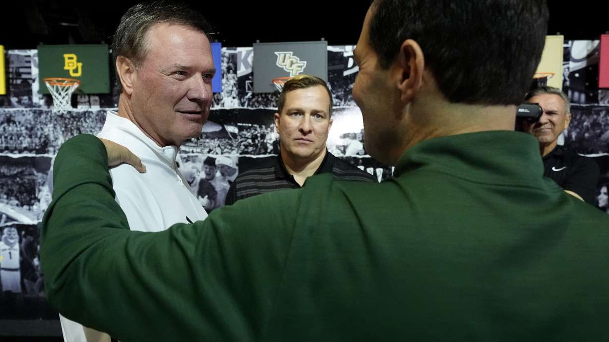 Kansas head coach Bill Self, left, talks with Iowa State head coach T.J. Otzelberger, center, and Baylor head coach Scott Drew during the NCAA college Big 12 men's basketball media day, Wednesday, Oct. 23, 2024, in Kansas City, Mo.